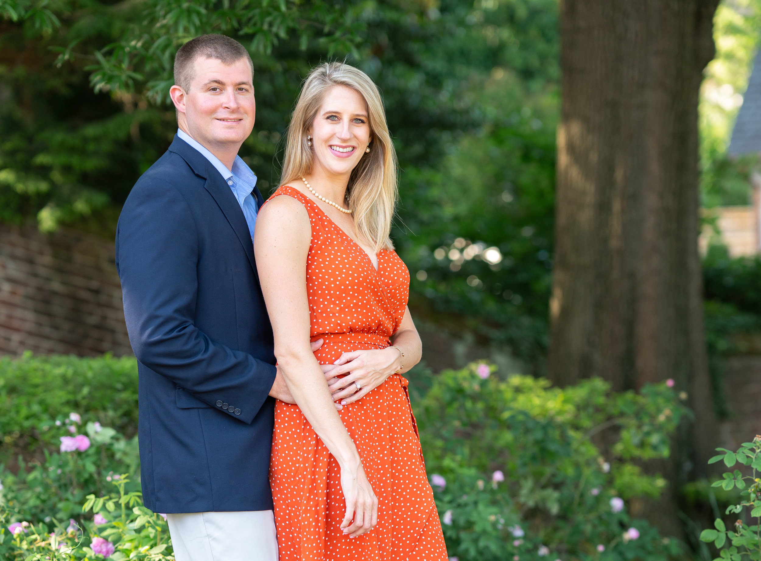 Orange dot dress and blue suit engagement outfit ideas