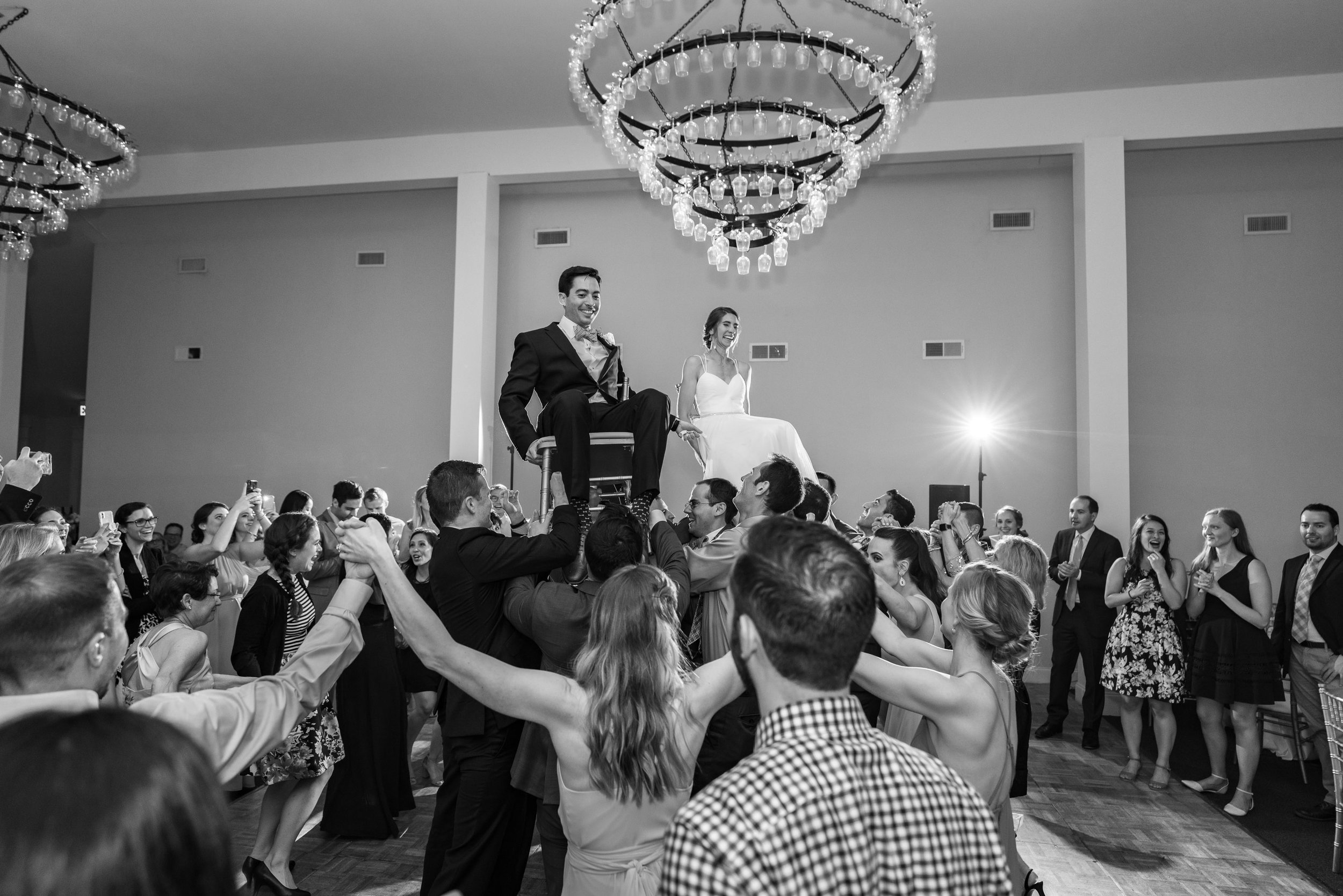 Bride and groom jewish wedding hora in maryland venue