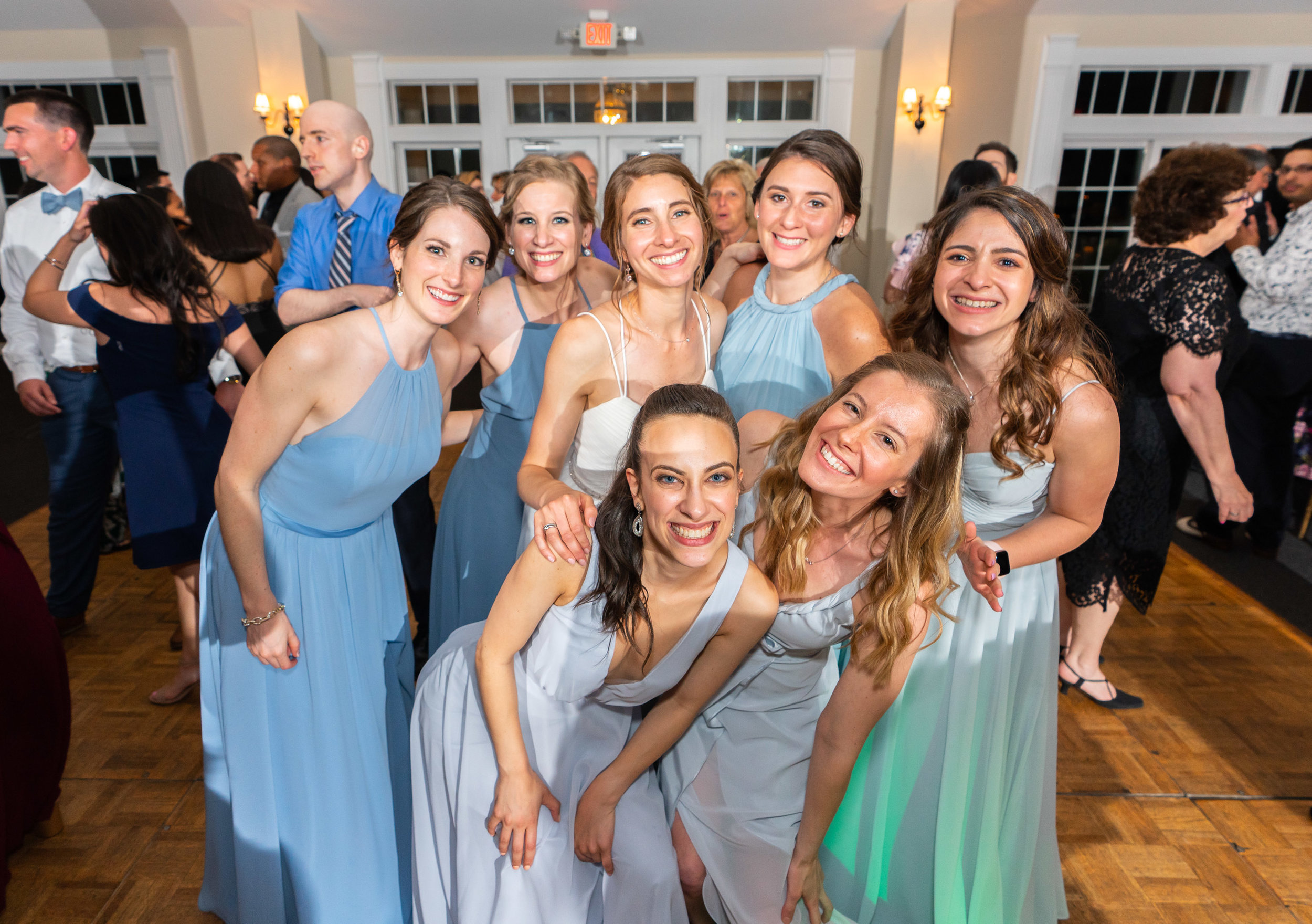 Bride and her bridesmaid squad on the dance floor
