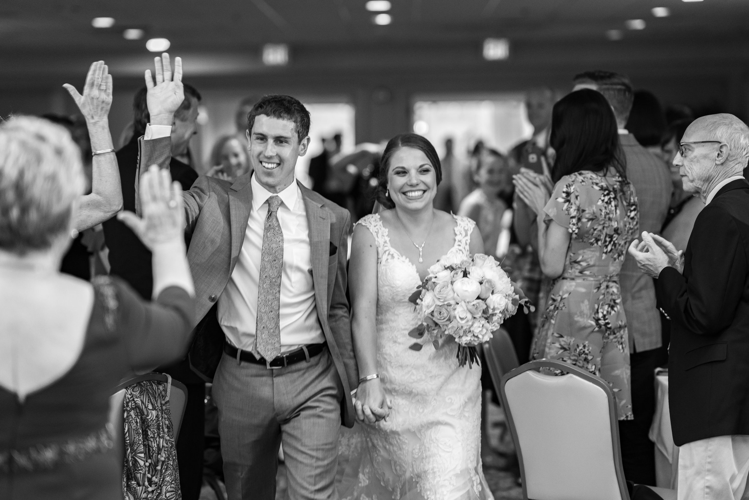 Bride and groom grand entrance into ballroom at Rehoboth Beach Country Club