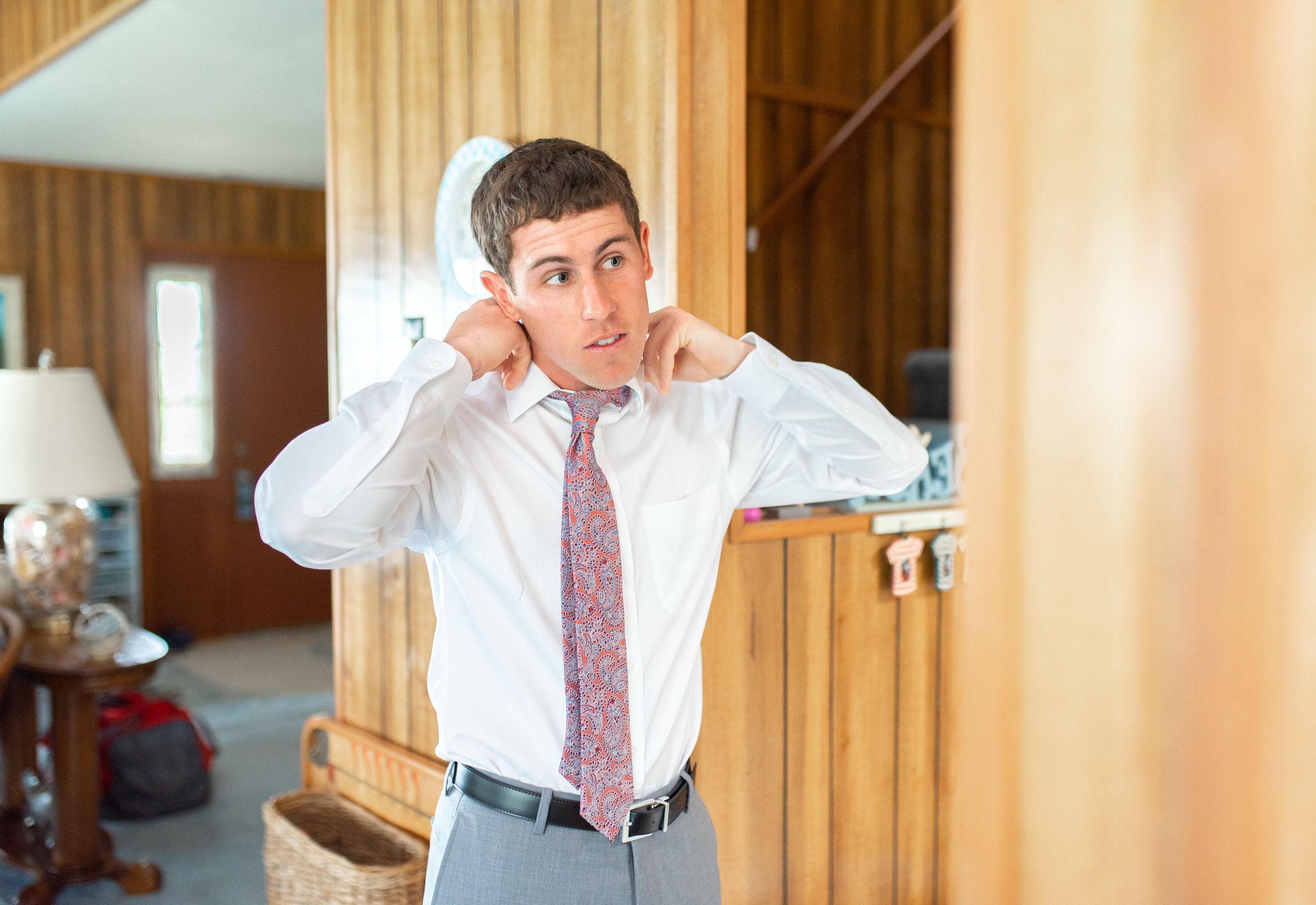 Groom getting ready for wedding at rehoboth beach country club