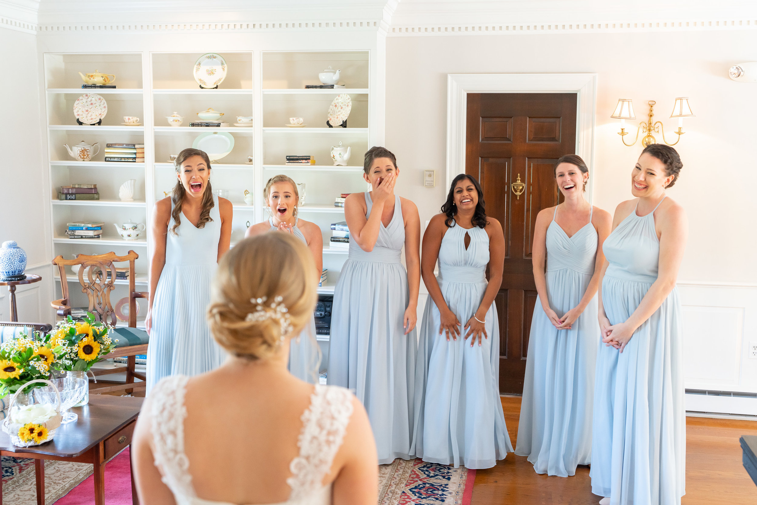 Bridesmaids in light blue azazie dresses at Stone Manor Country Club