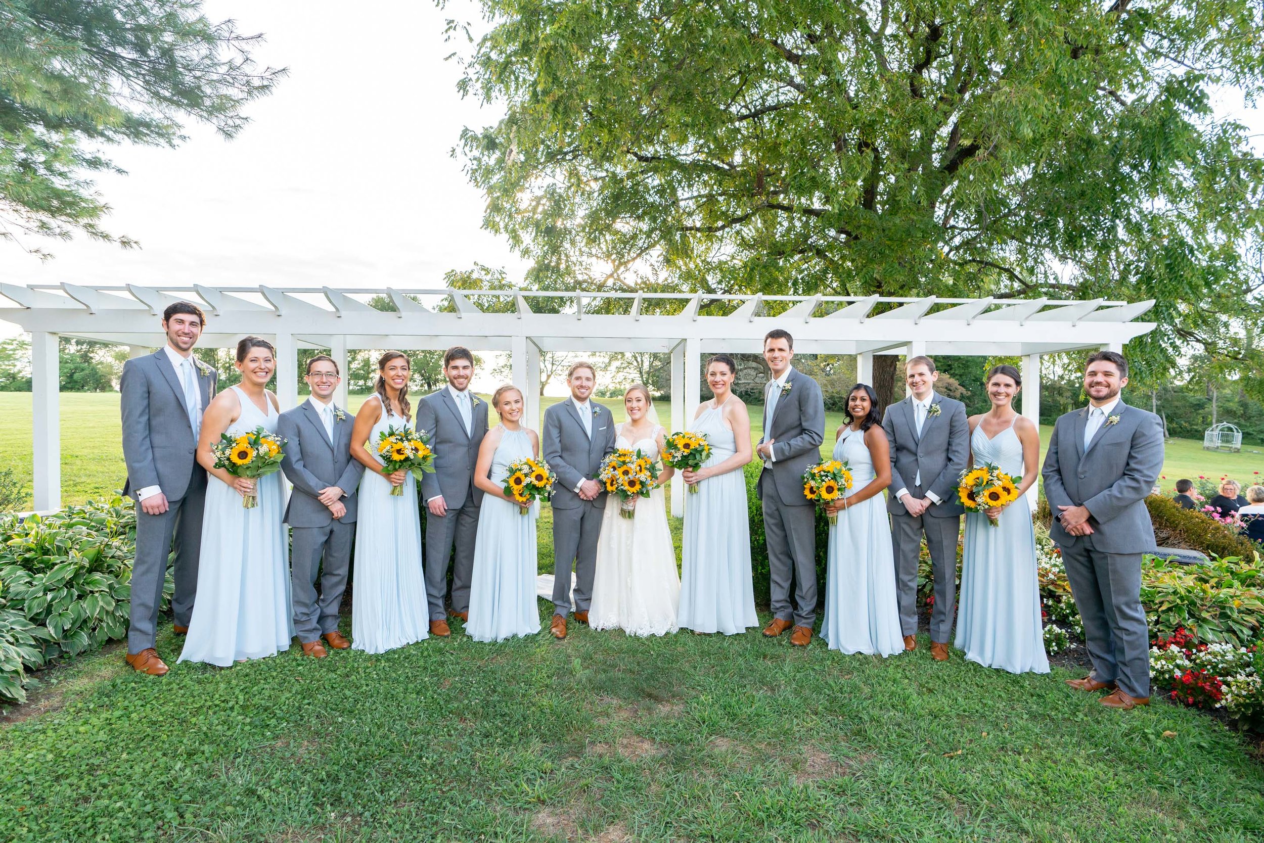 Bridal party with bridesmaids and groomsmen at Stone Manor Country Club