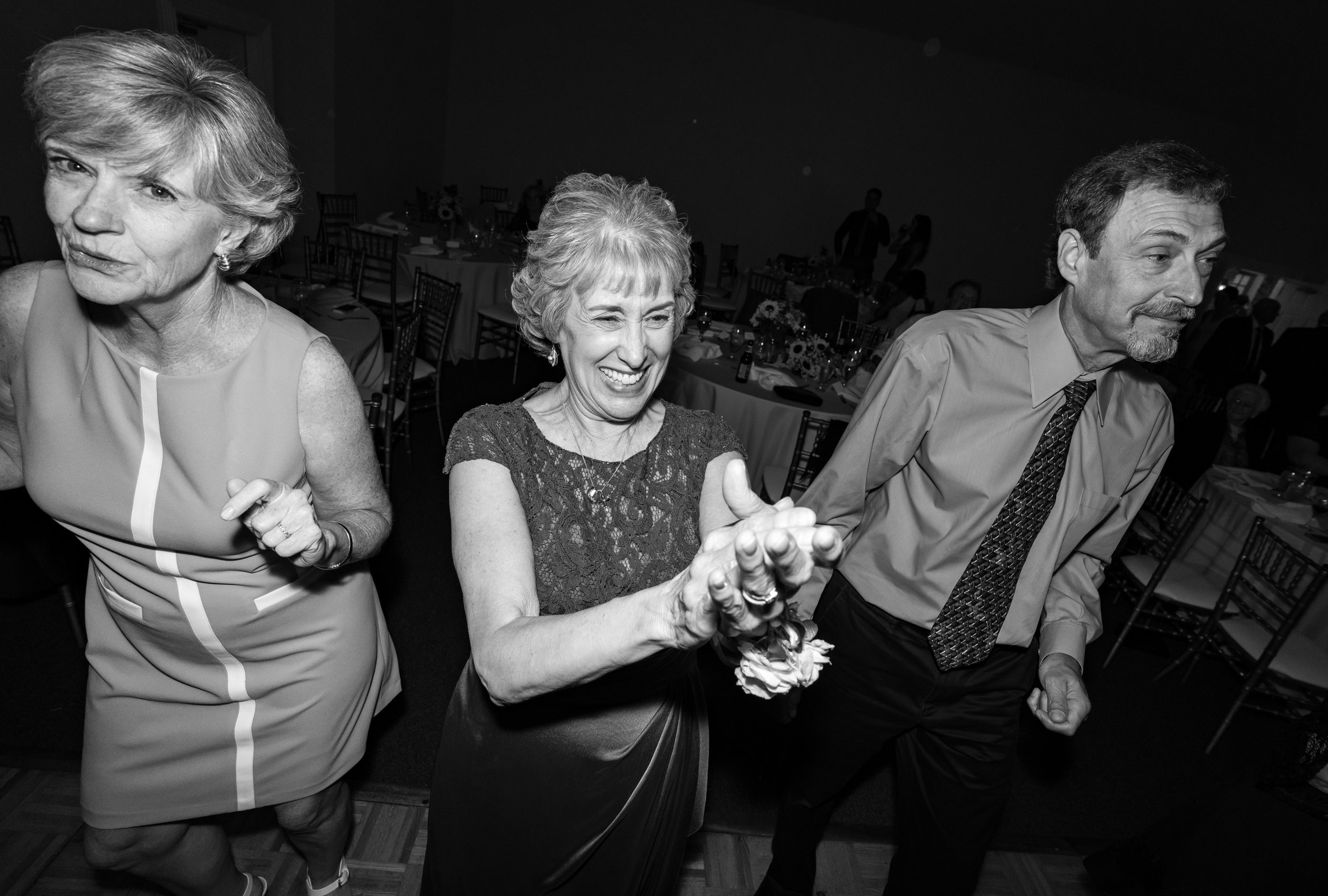 mother and family laughing on the dance floor at stone manor country club