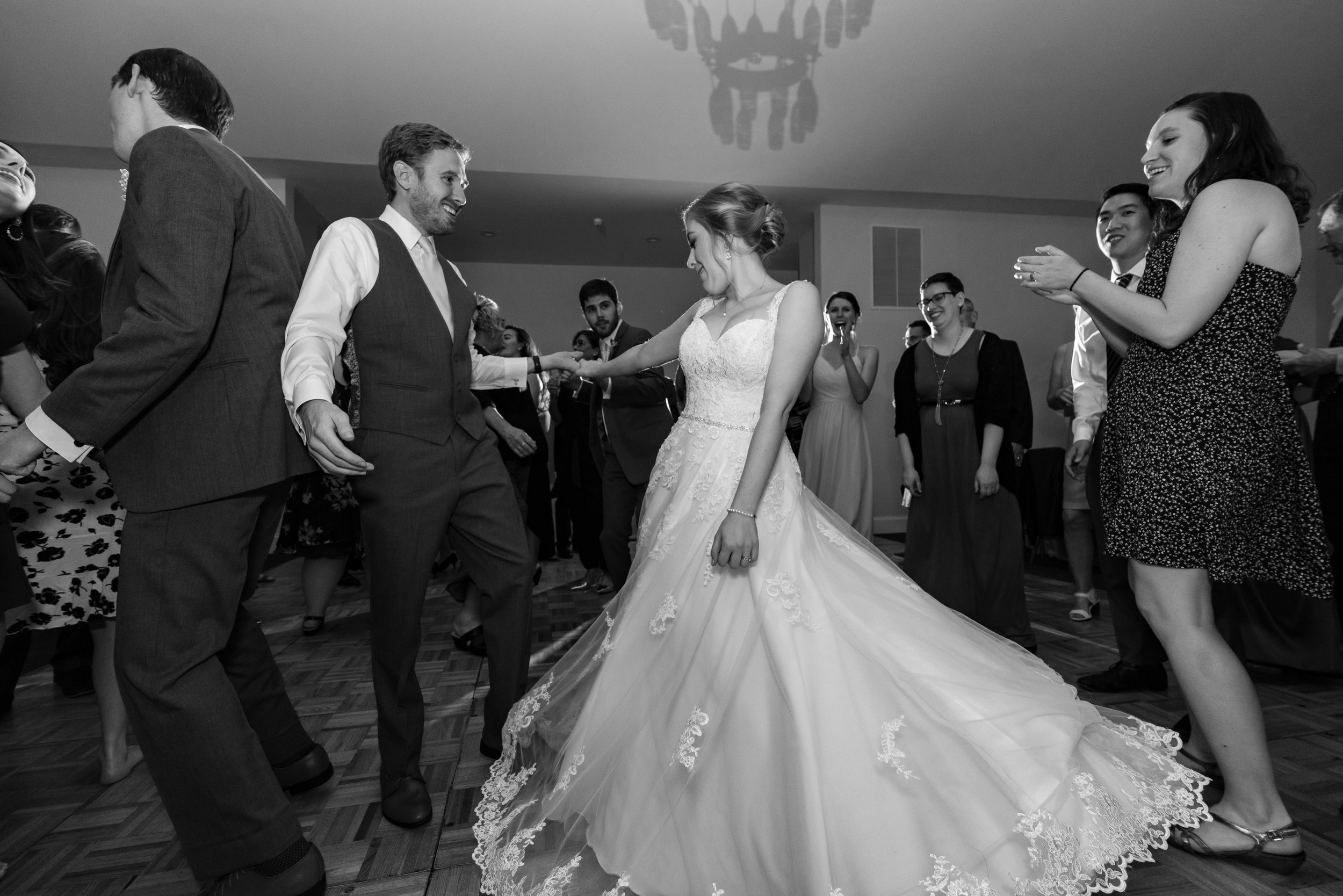 groom spinning bride on the dance floor at stone manor country club