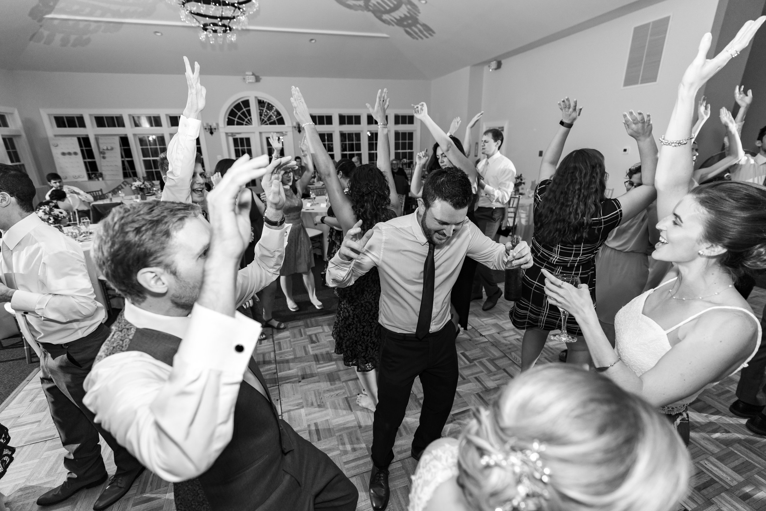 groom and friends dancing at stone manor country club
