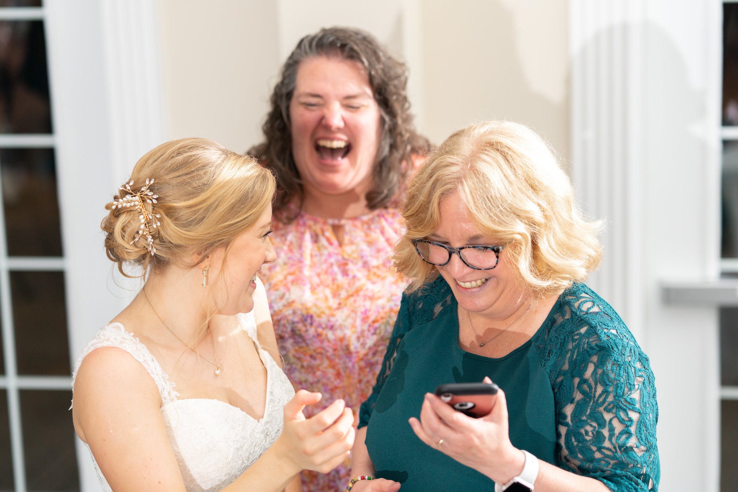 bride taking selfie with guests at stone manor country club