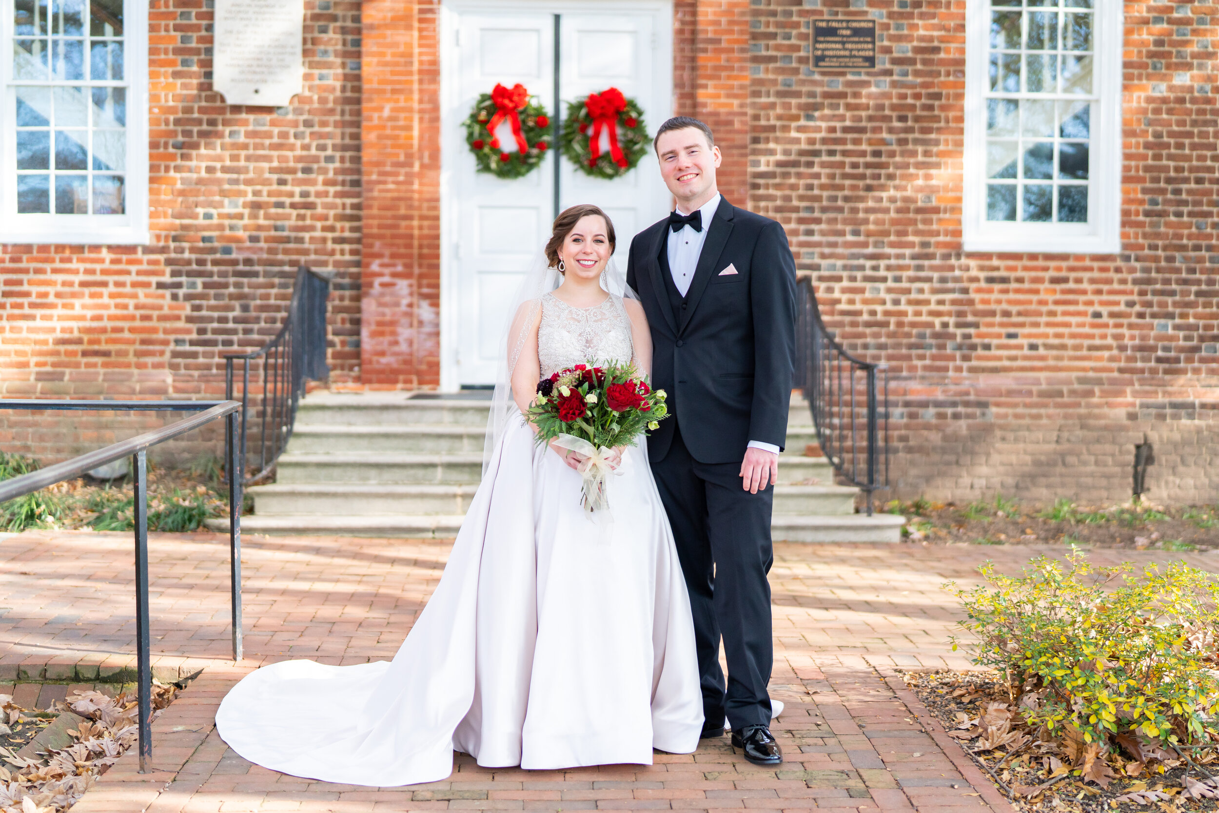 bridal portrait in front of christmas wreaths at the falls church episcopal 