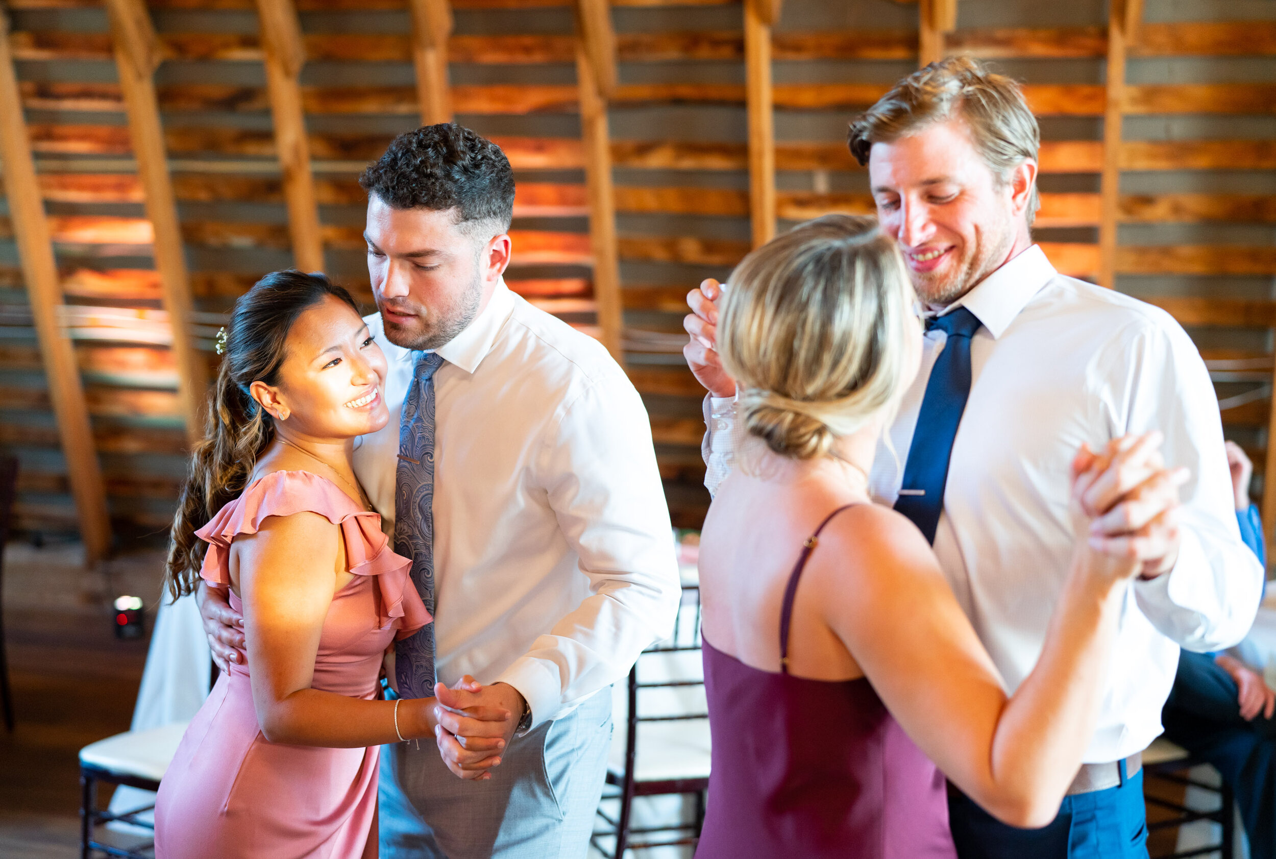 Couples dancing during the wedding reception in the sunset