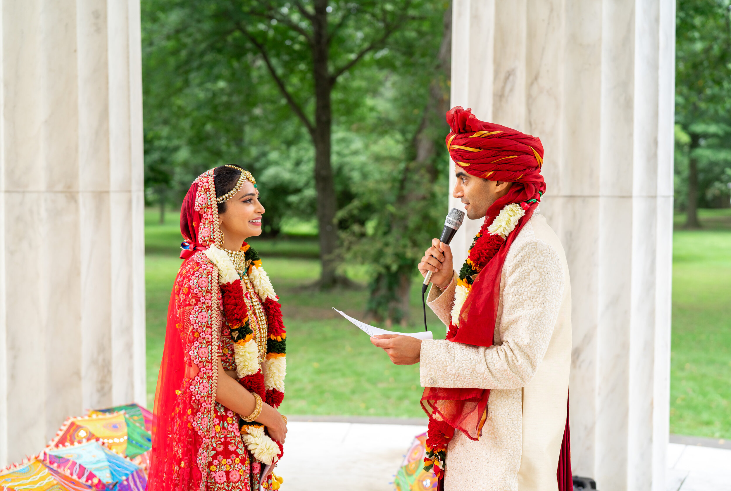 Groom reading vows to indian bride in Washington DC War Memorial
