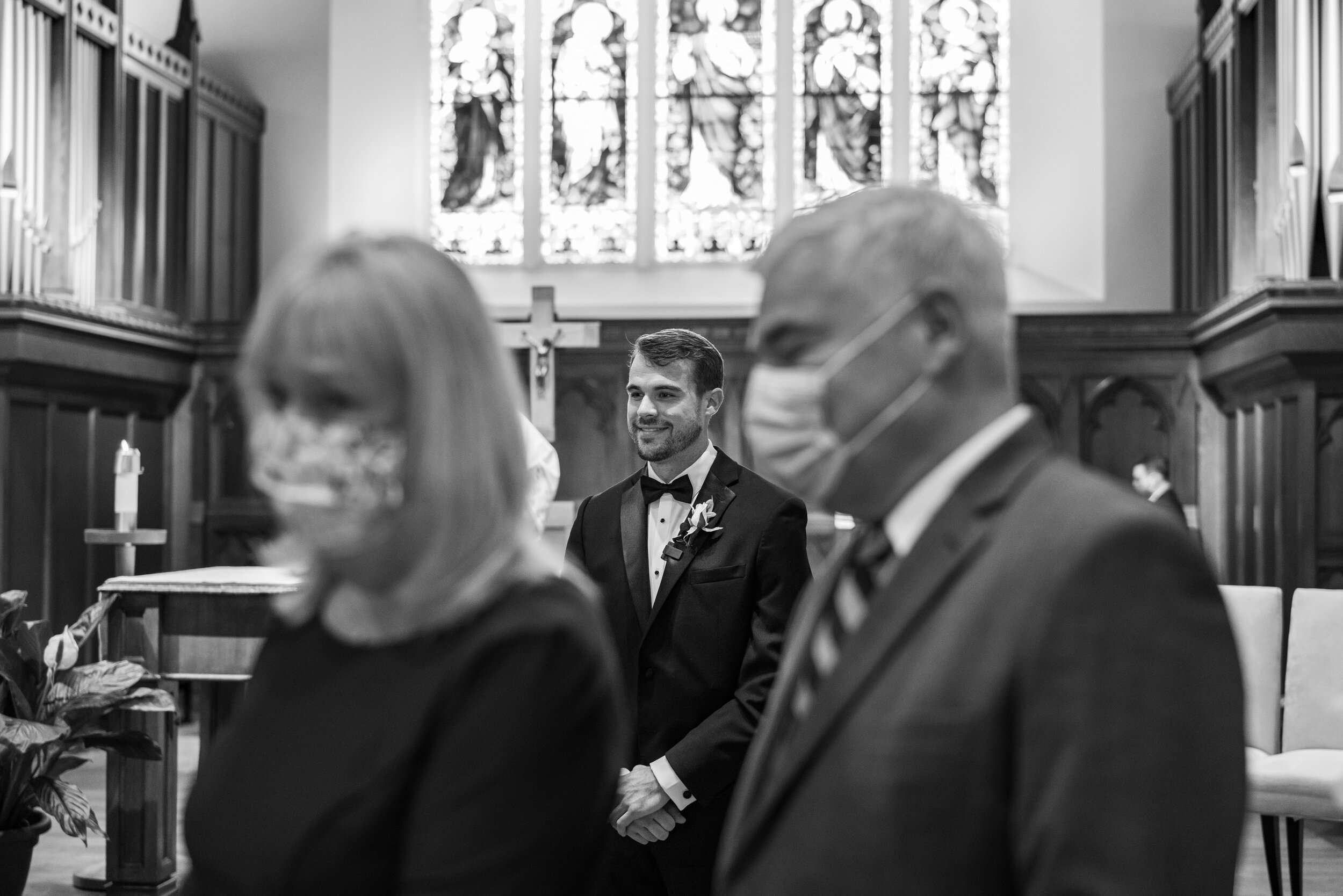 Groom watching bride walk down aisle at Dahlgren Chapel wedding ceremony in Georgetown
