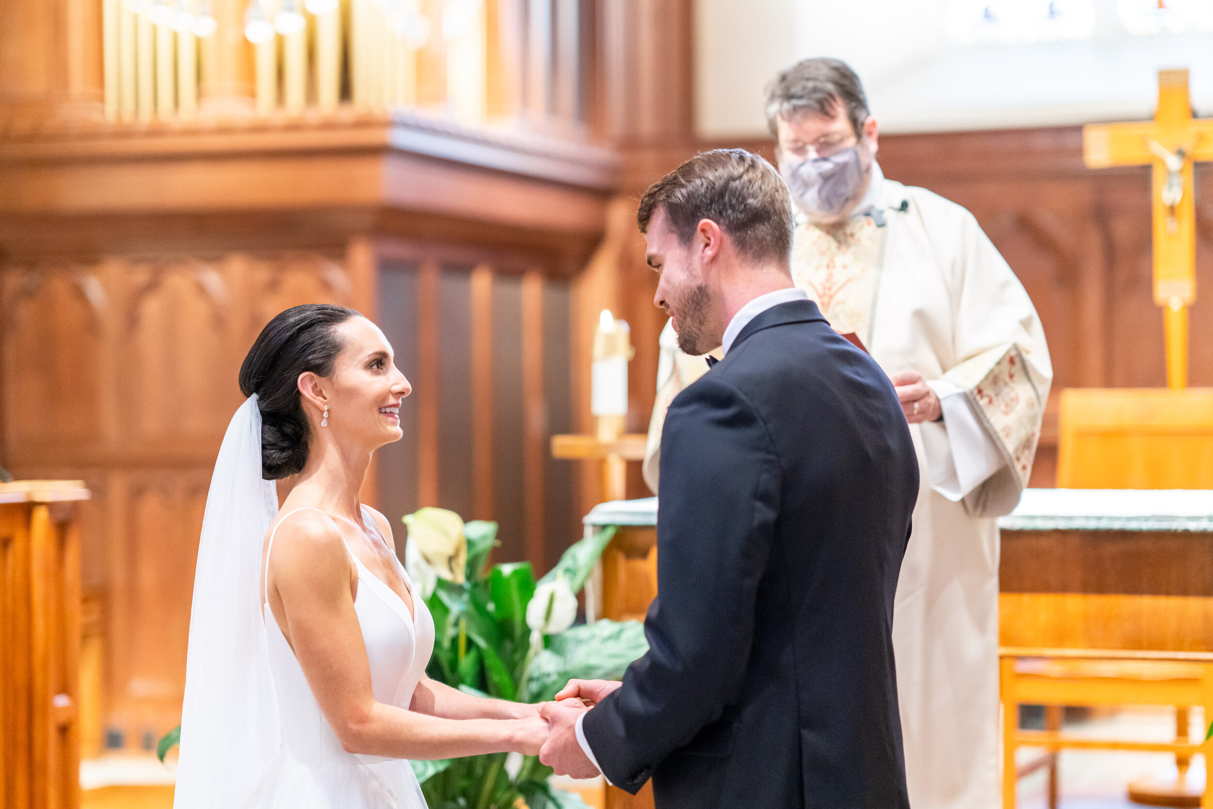 Bride and groom Catholic ceremony at Dahlgren Chapel in DC