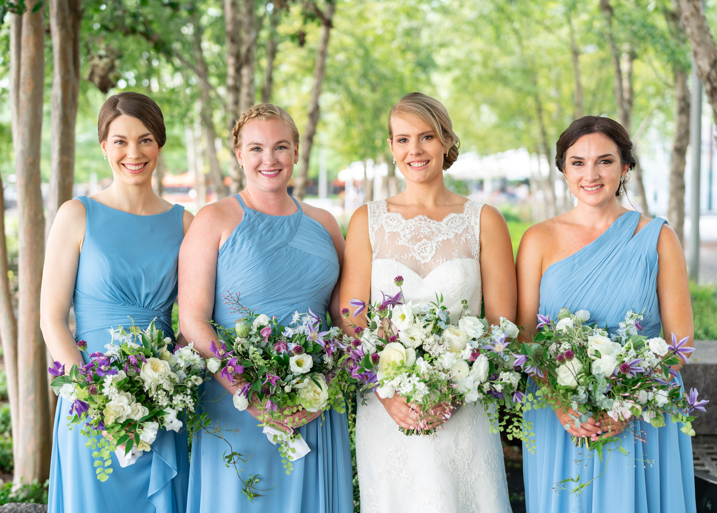 Bride and bridesmaids in blue Azazie gowns