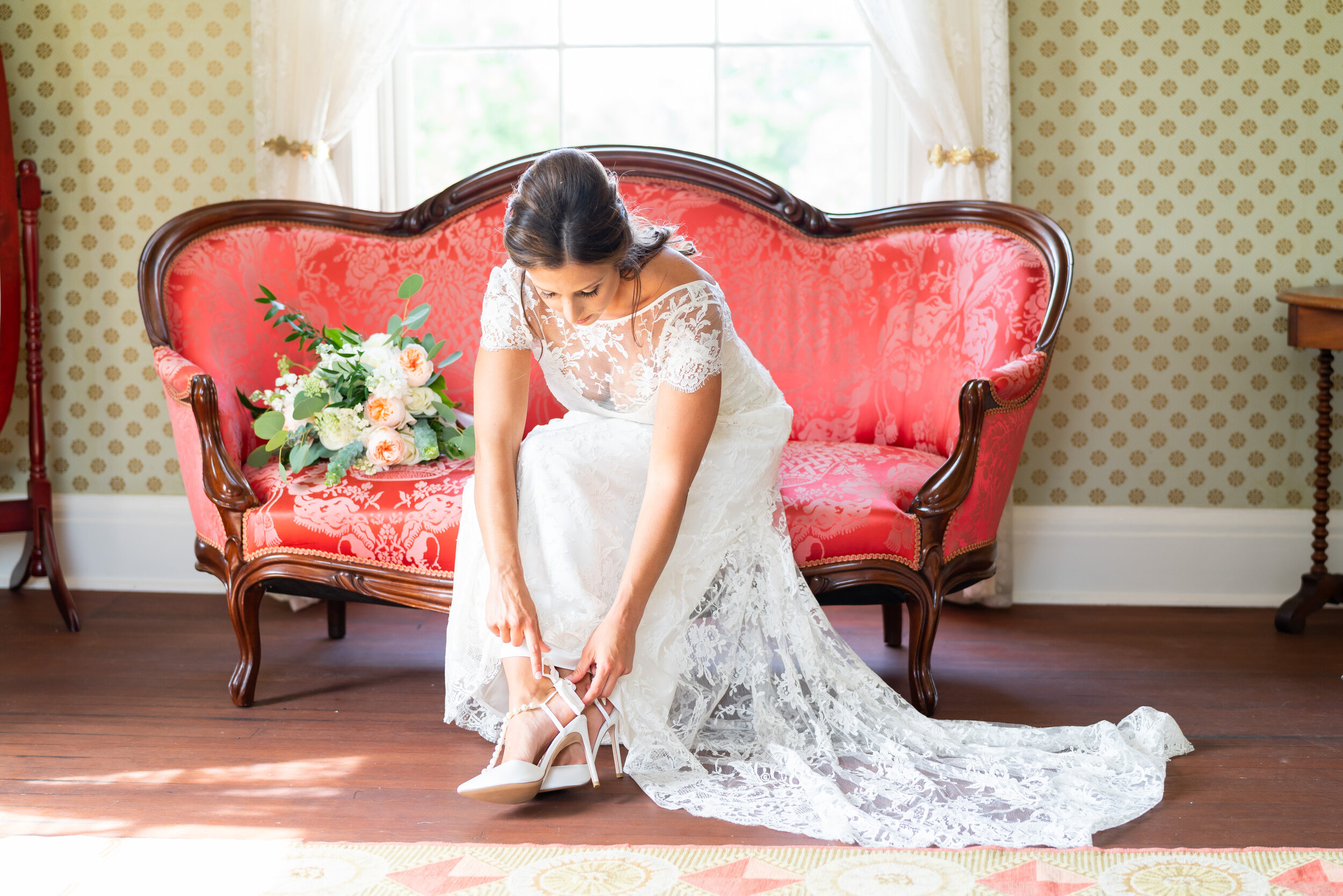 Bride tying Bella Belle shoes at President Lincoln's Cottage wedding