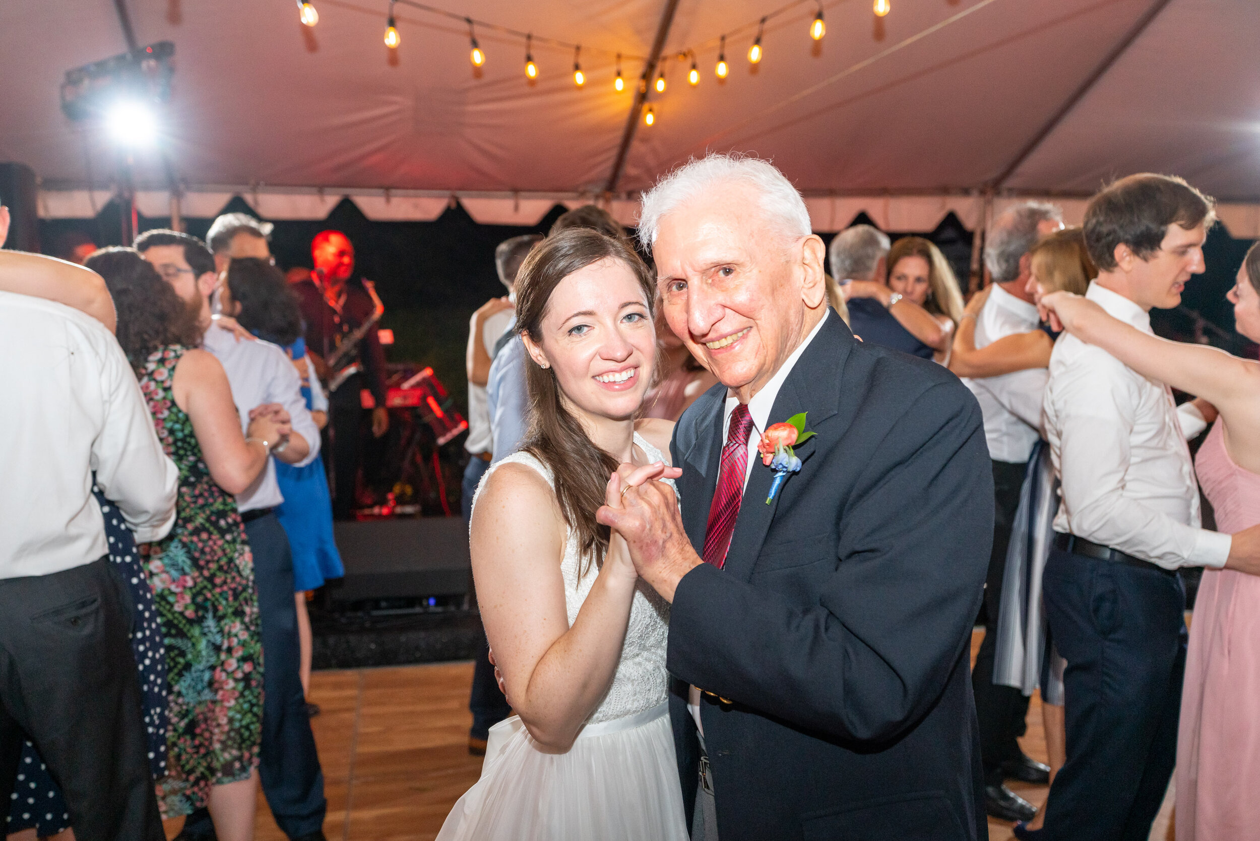 Bride dances with her grandpa under tent at Rockville Glenview Mansion