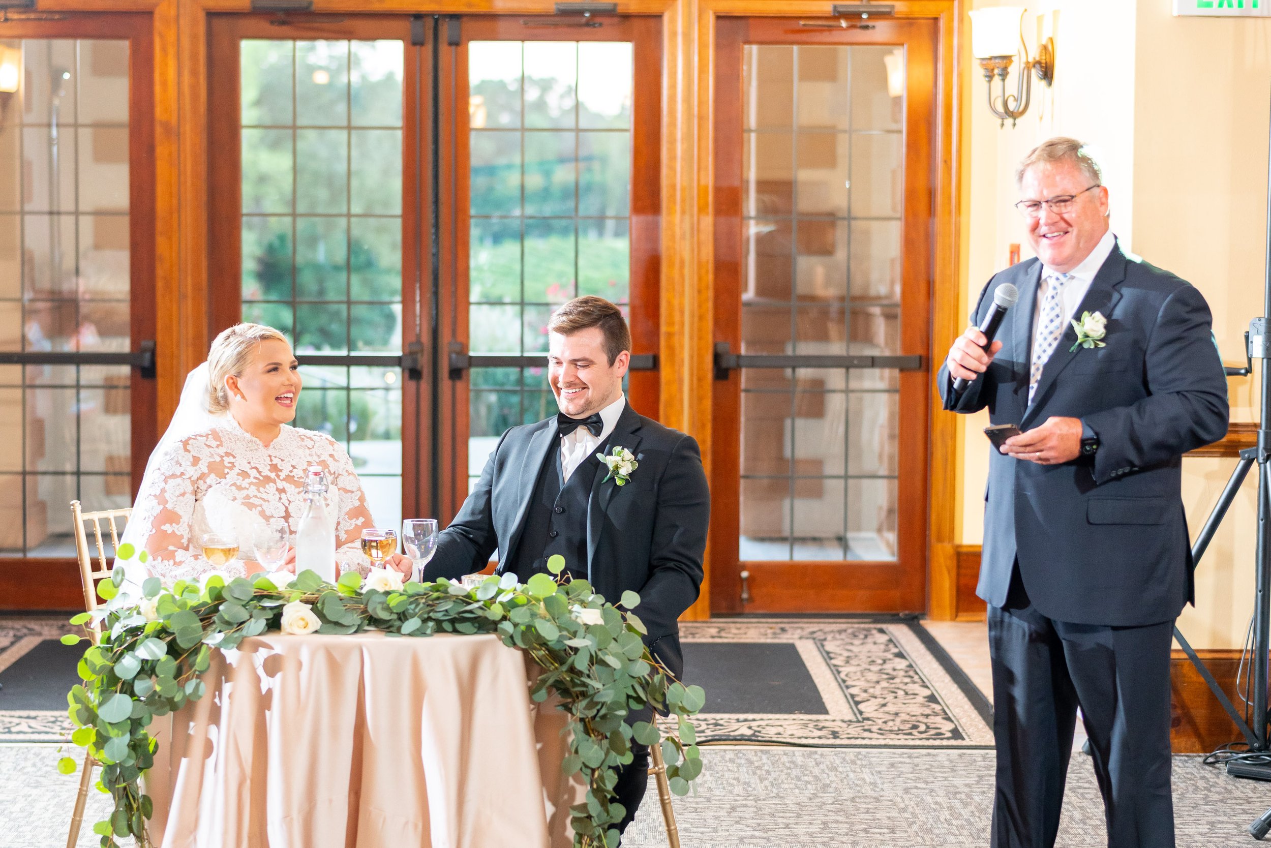 bride and groom react to father of the bride toast