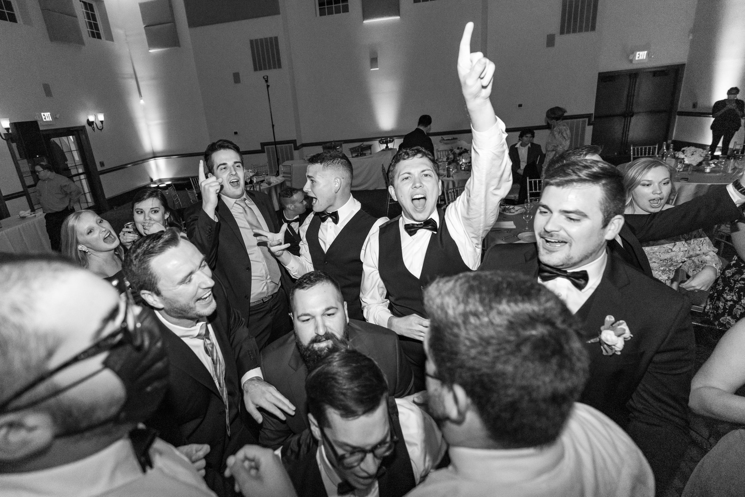 black and white photo of groom on the dance floor