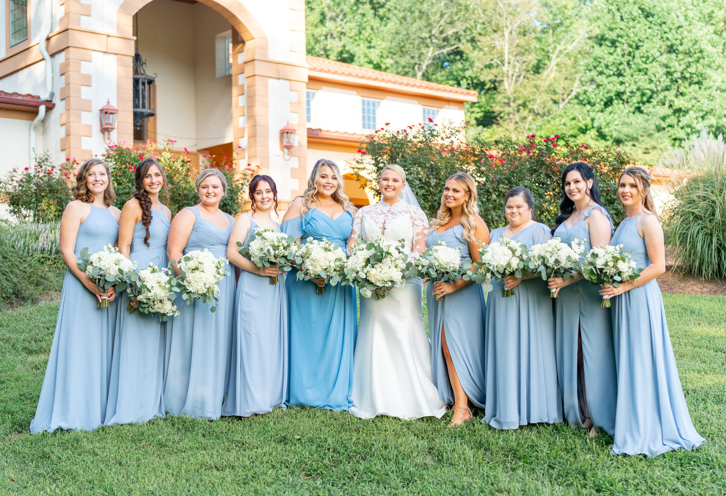 bridesmaids line up for group photo at running hare vineyard 