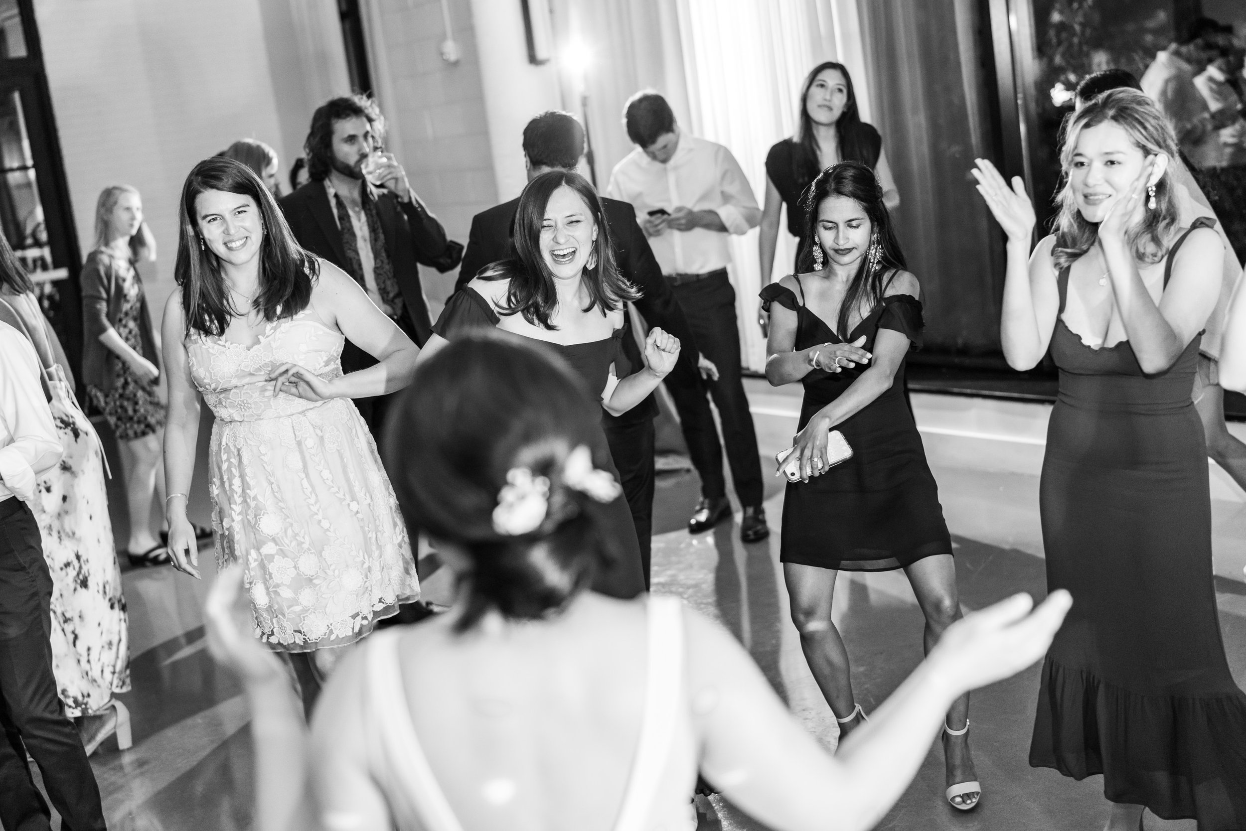 Bride dances the last song with her fun wedding guests at the Eaton hotel