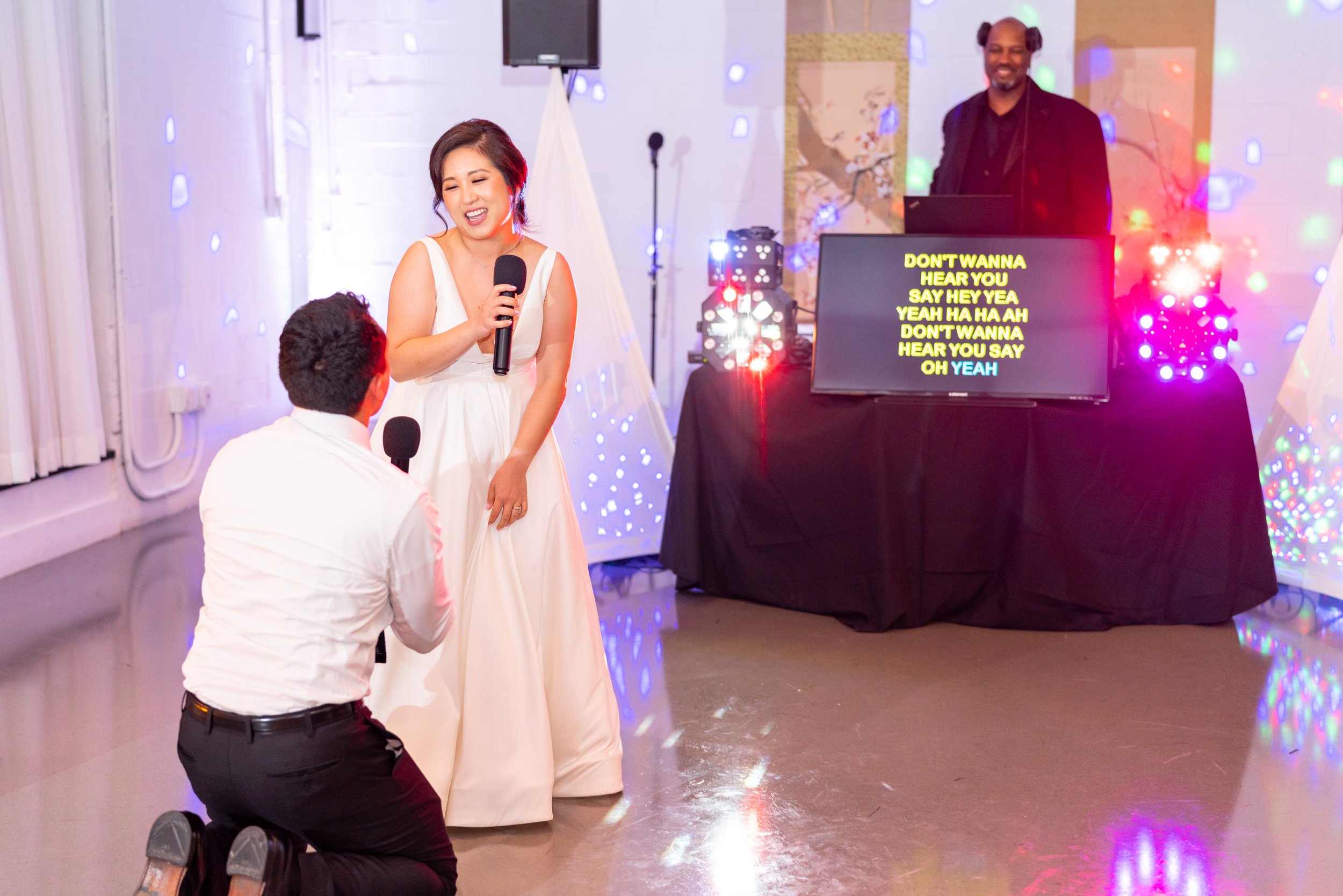 Bride and groom karaoke during fun wedding reception in Washington DC