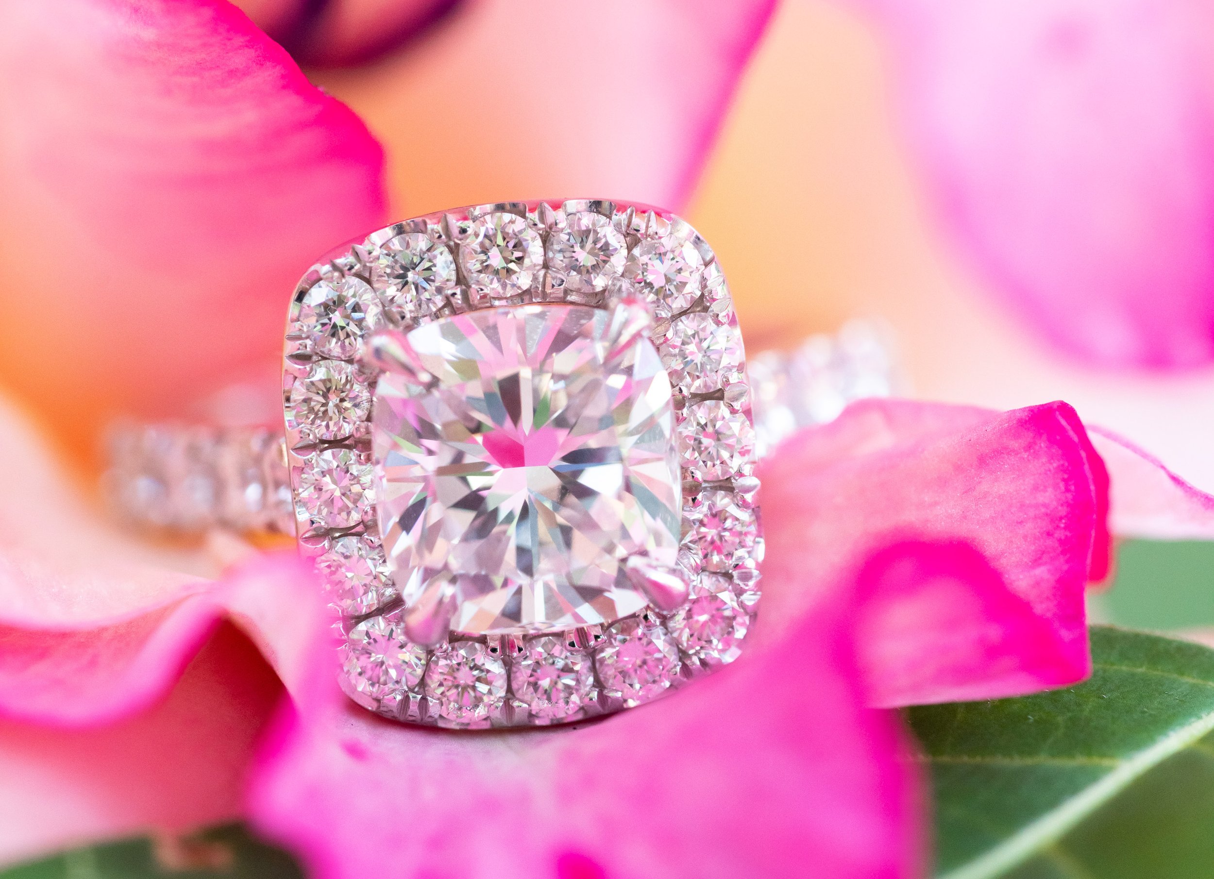 Cushion cut engagement ring with halo in pink flowers ring photo