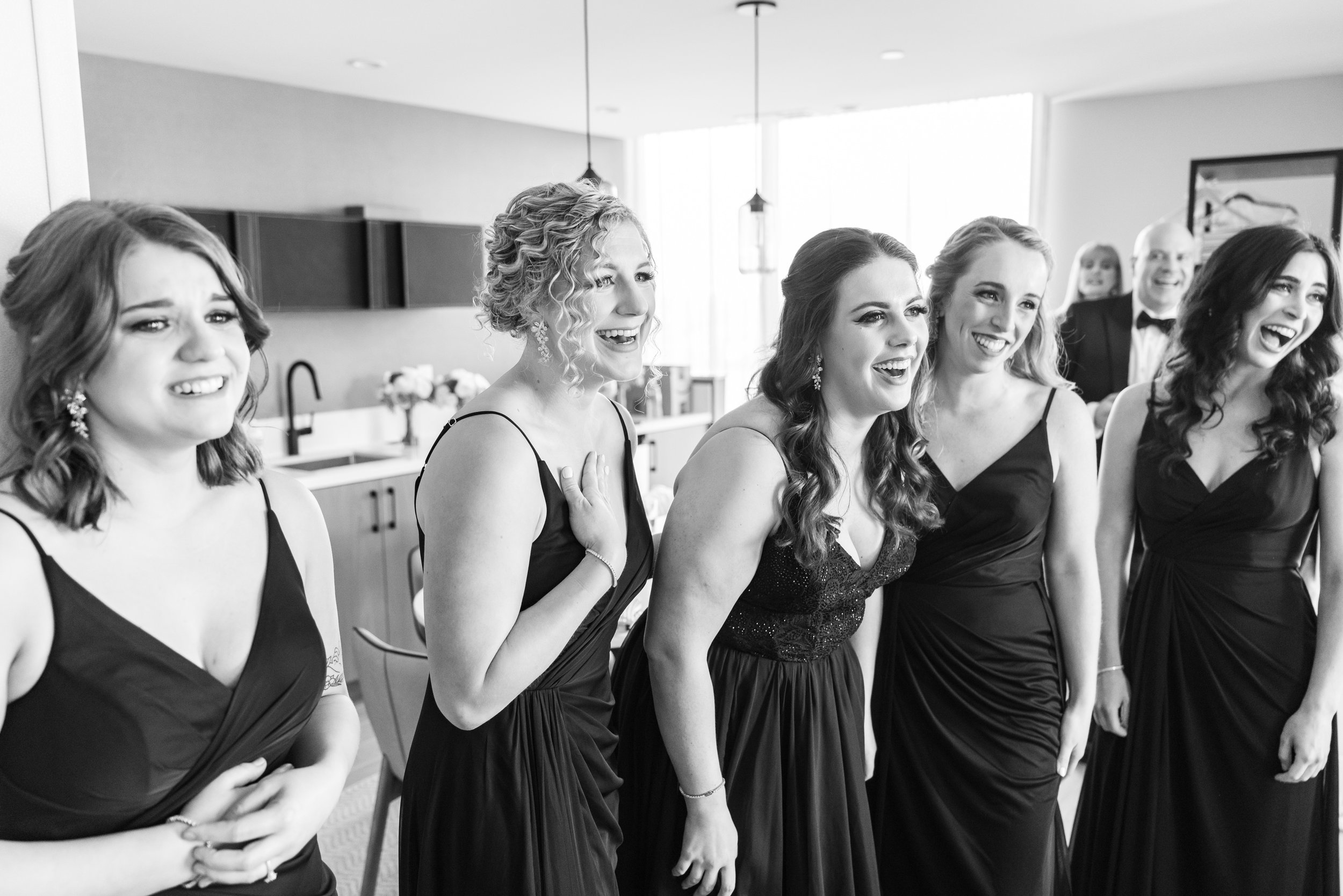 Candid bridesmaid reactions to seeing beautiful bride at Watermark Hotel
