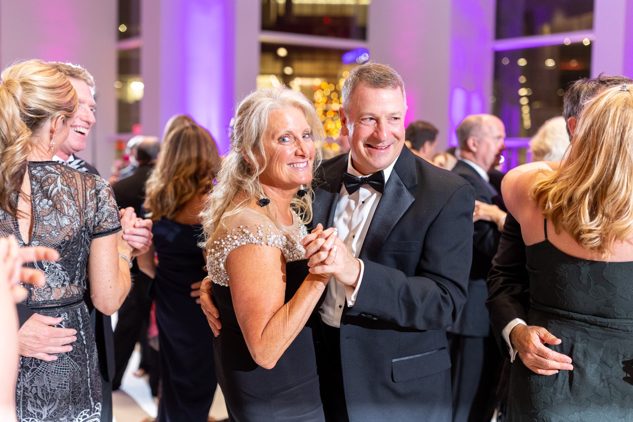 Couple dances during fun wedding reception at Capital One Hall