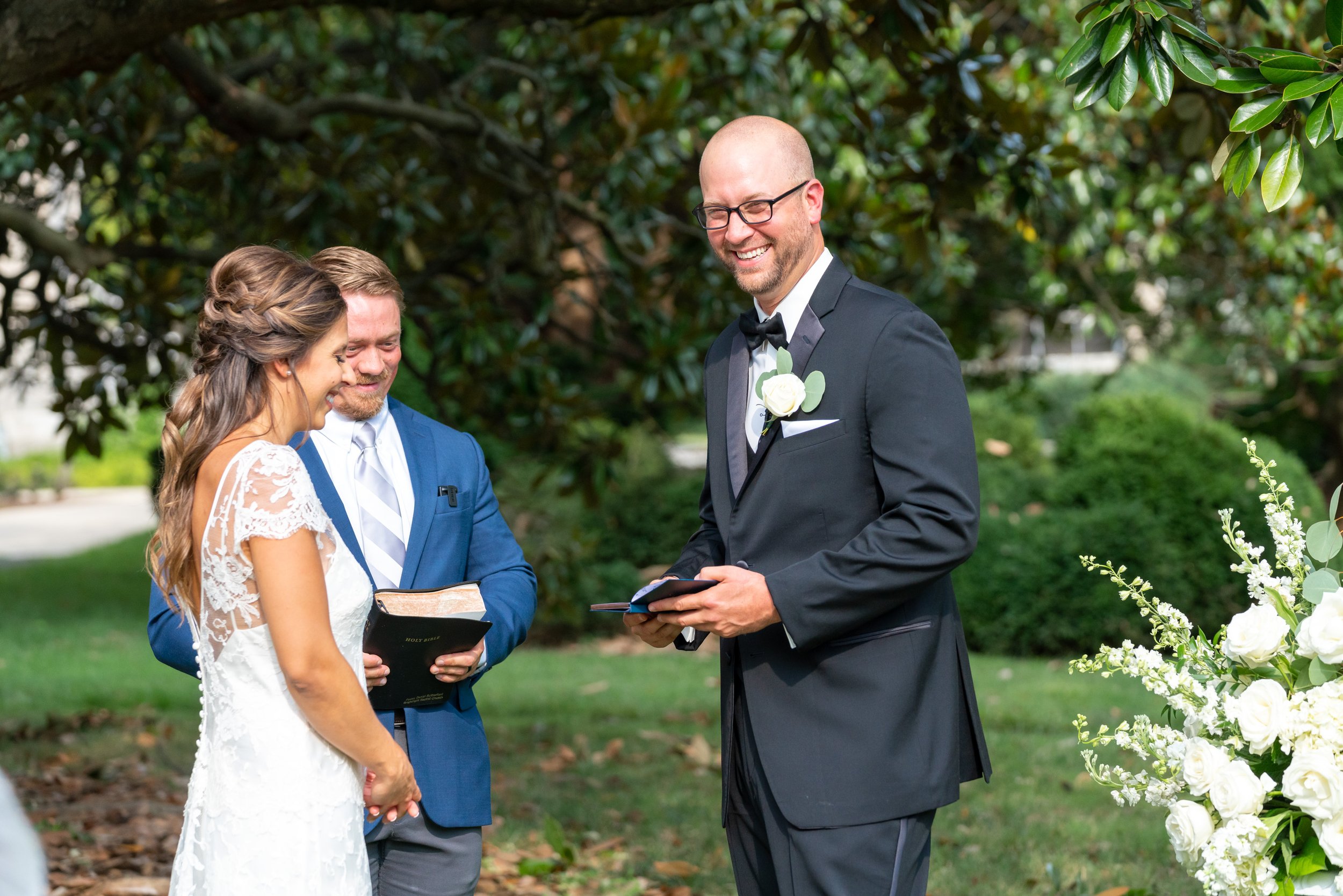 Groom laughs as he reads his vows to his bride at this fun wedding in DC