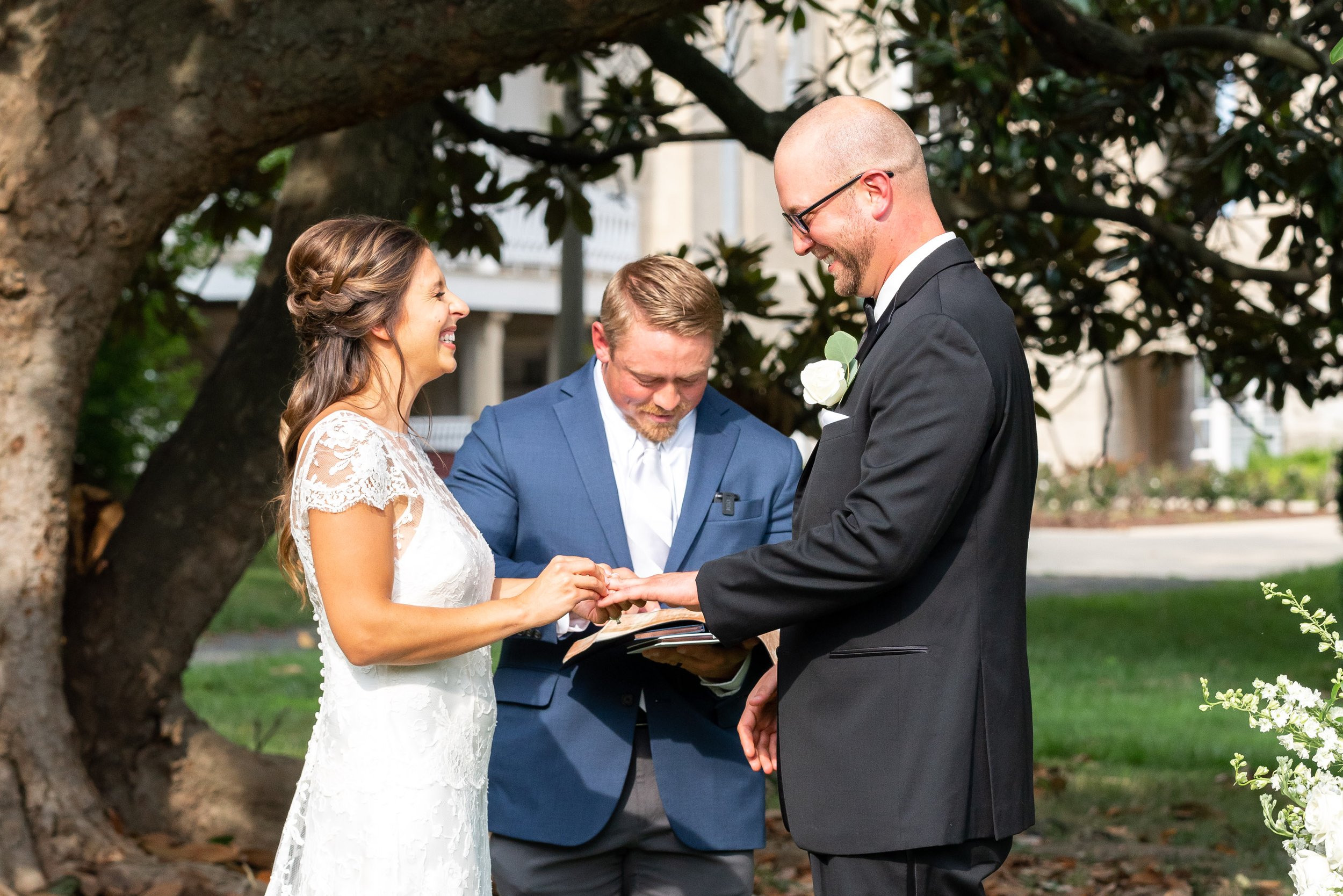 Wedding ceremony photos under magnolia tree in the summer