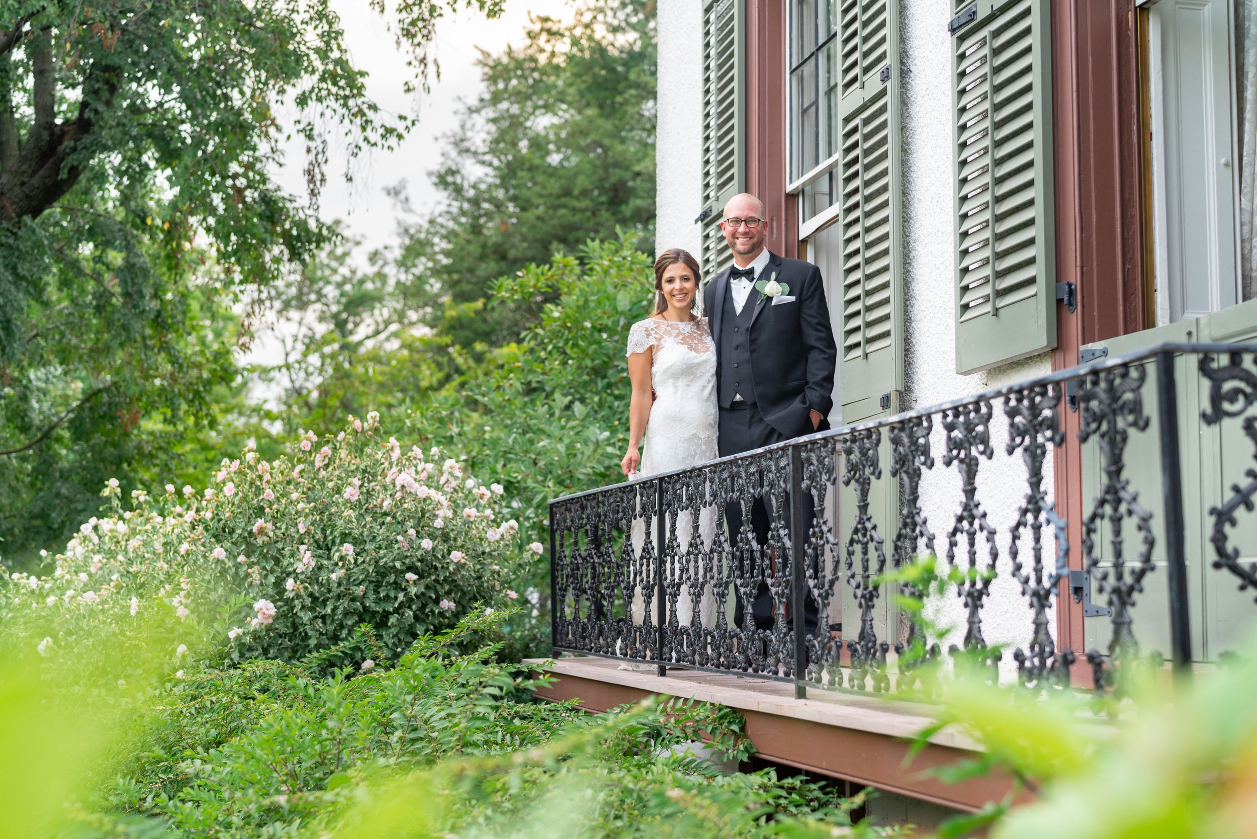 Bride and groom on balcony at President Lincoln's Cottage
