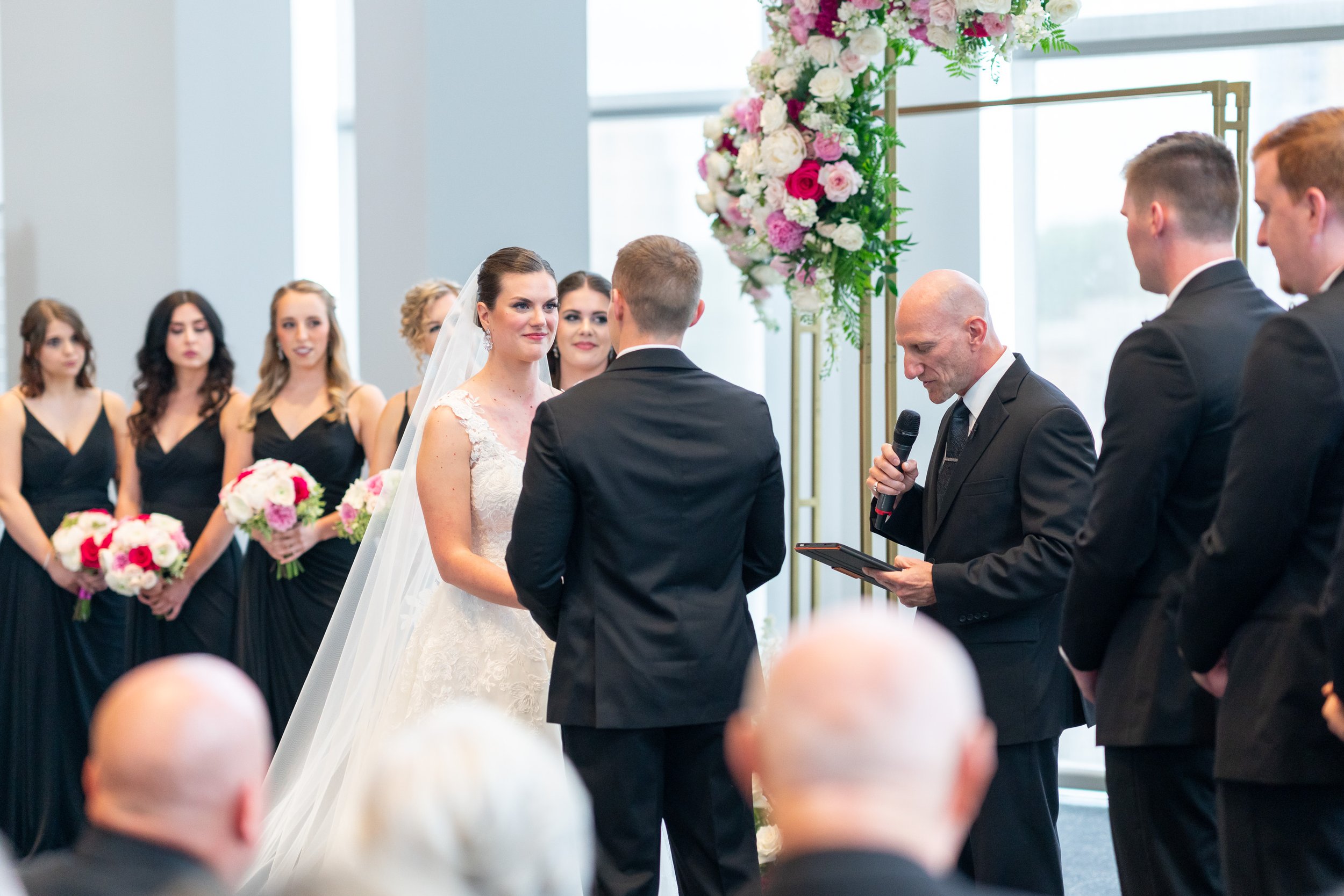 Bride looking at groom during vows at Capital One Hall