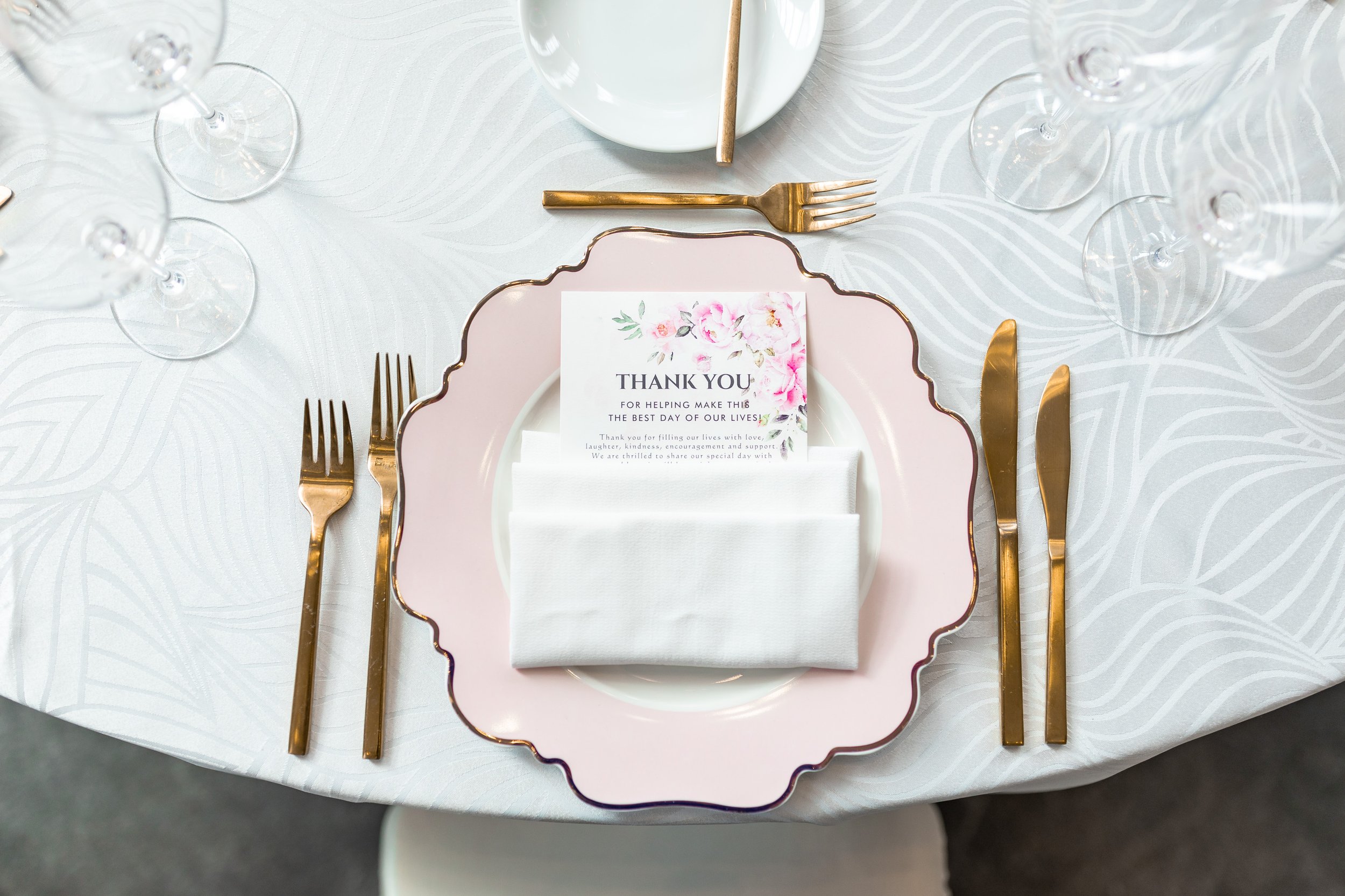 Pink and gold wedding color ideas with table cloth and decor