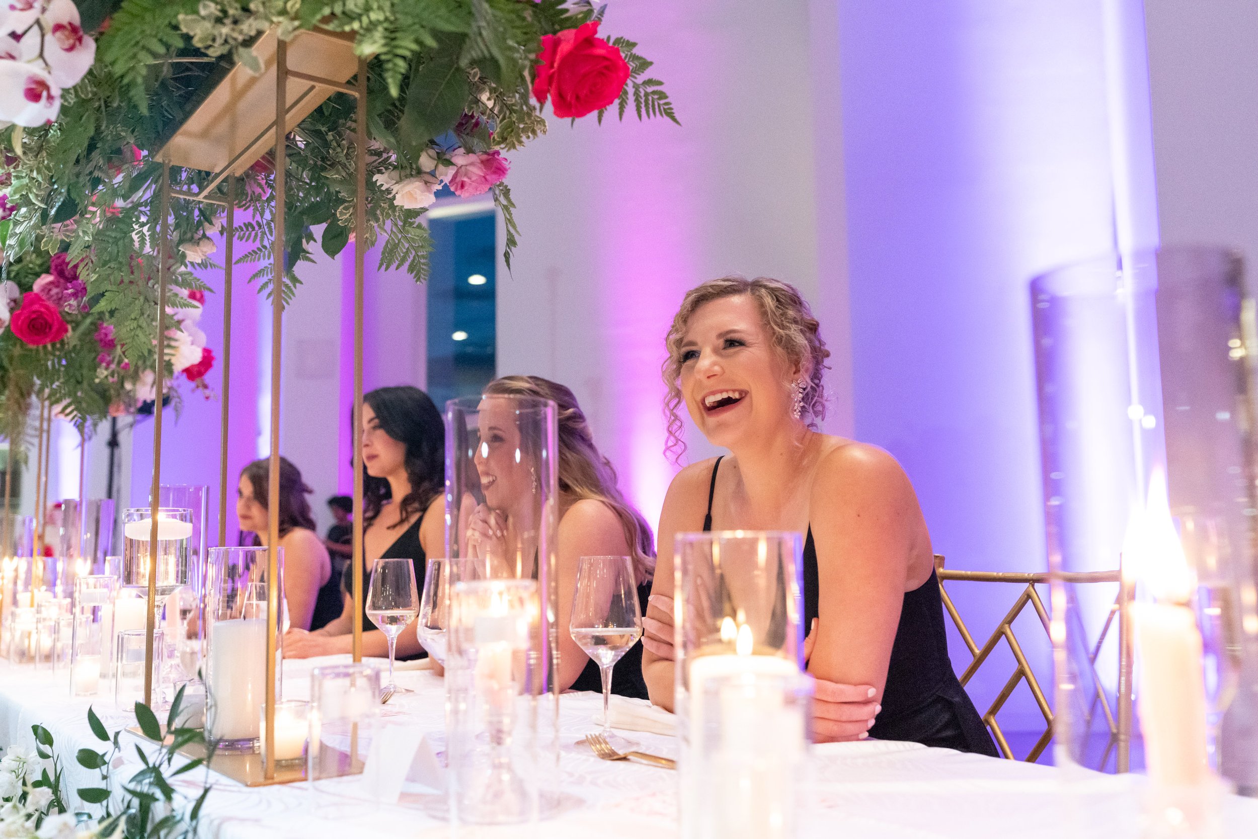 Bridesmaids candid photos as they react to funny speeches