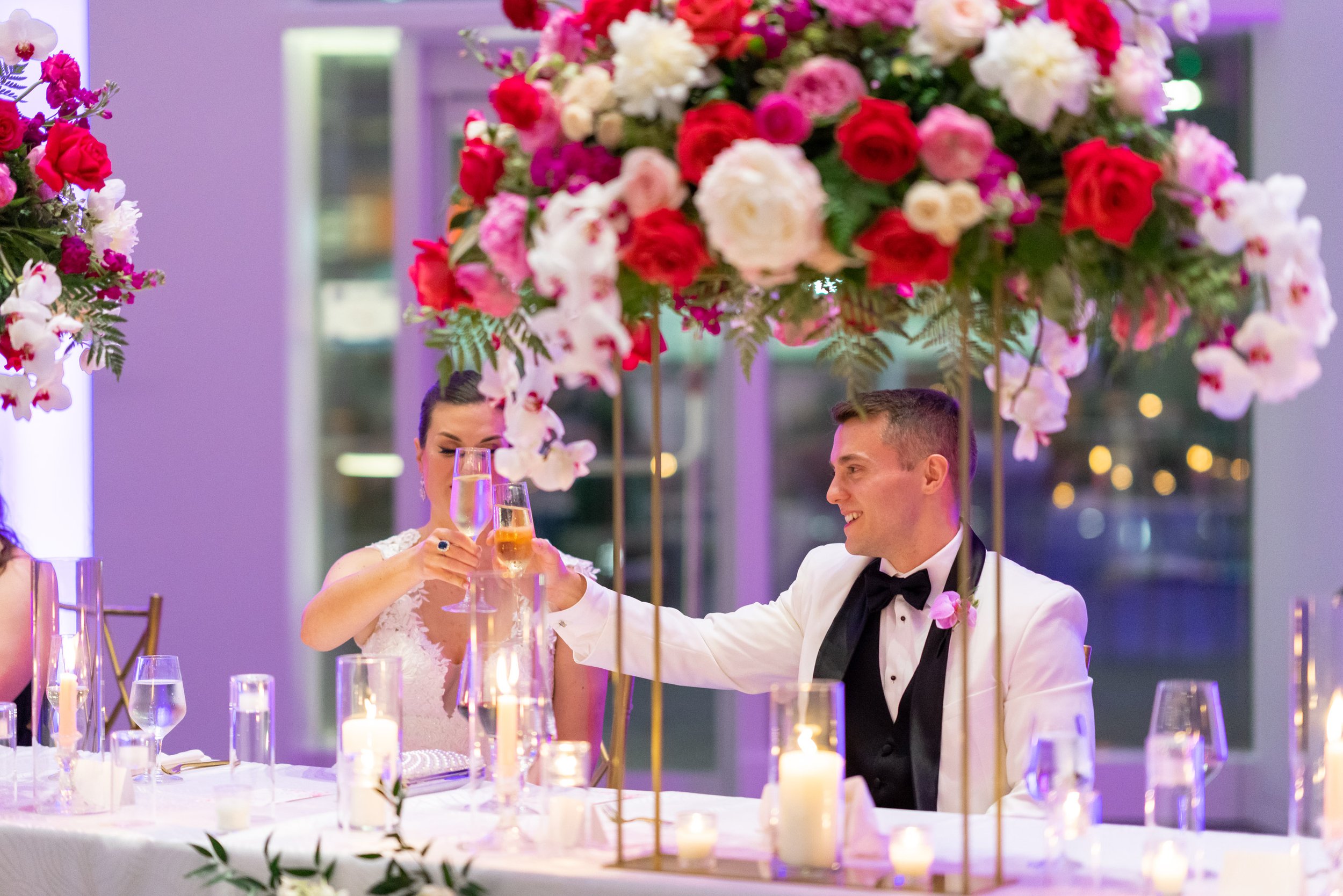 Bride and groom toast champagne during speeches