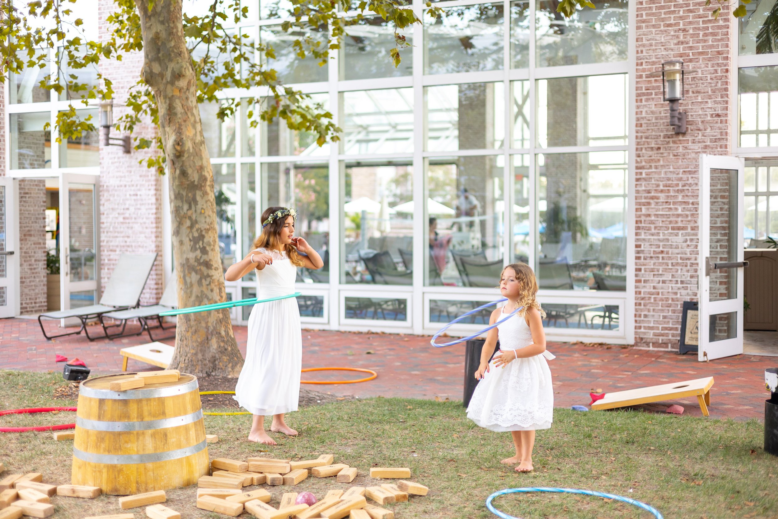 Flower girls playing hula hoops in fun wedding photos at Hyatt Chesapeake