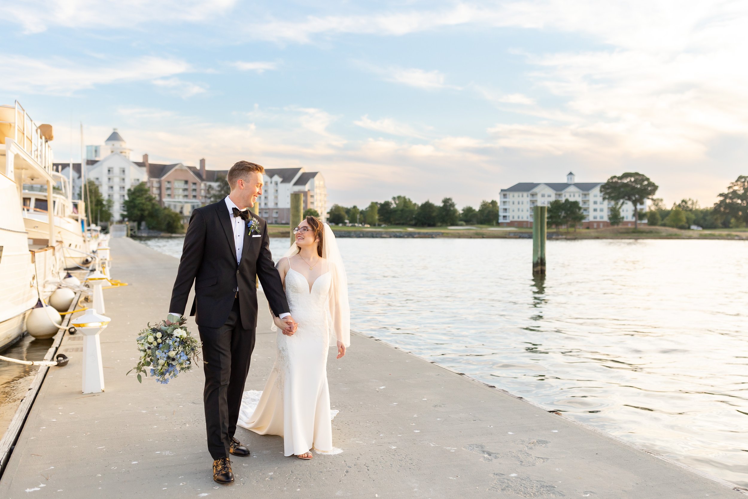 Bride and groom walk on the pier at Hyatt Regency Chesapeake wedding in Cambridge