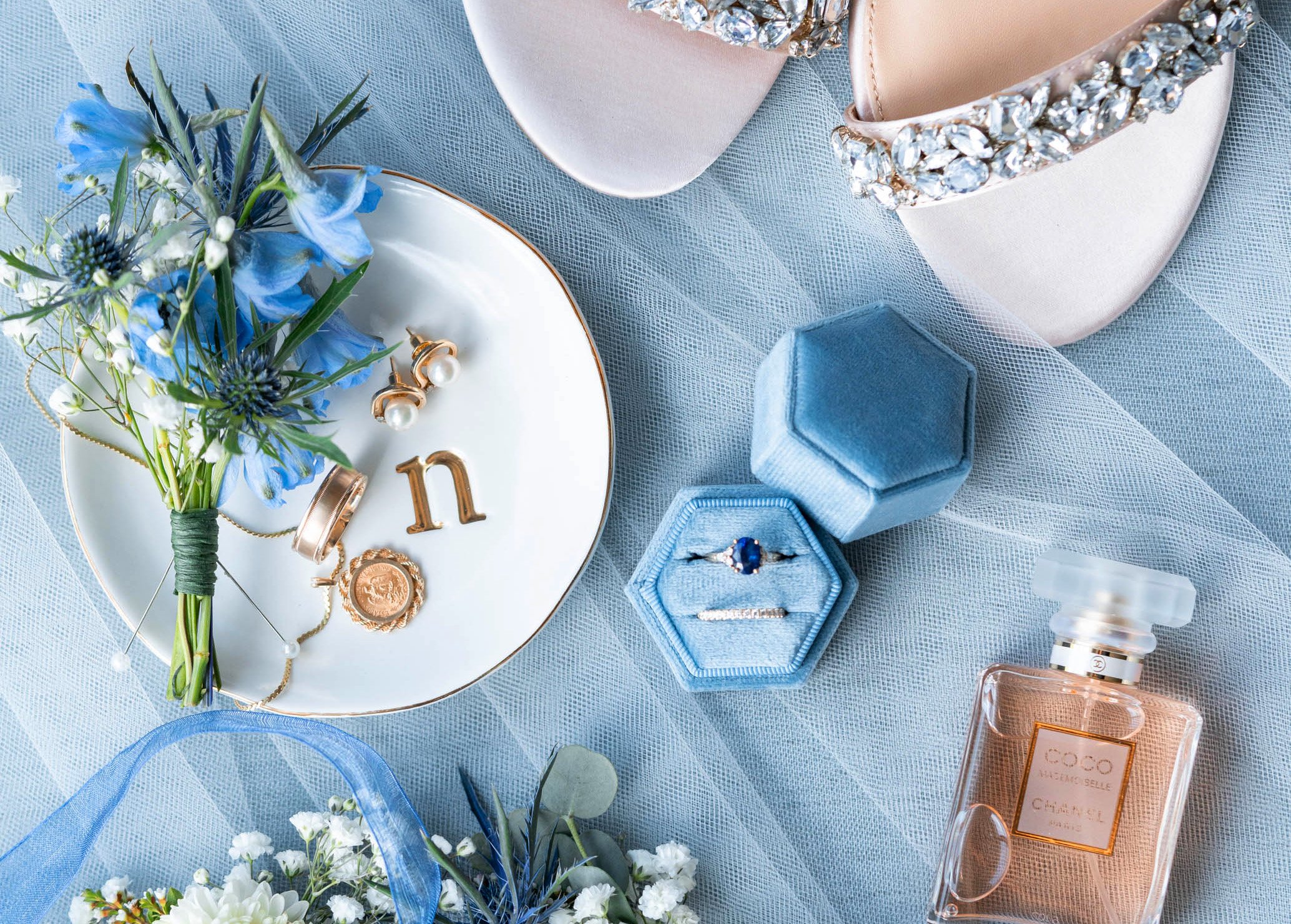 Blue details photo with Chanel perfume and ring dish