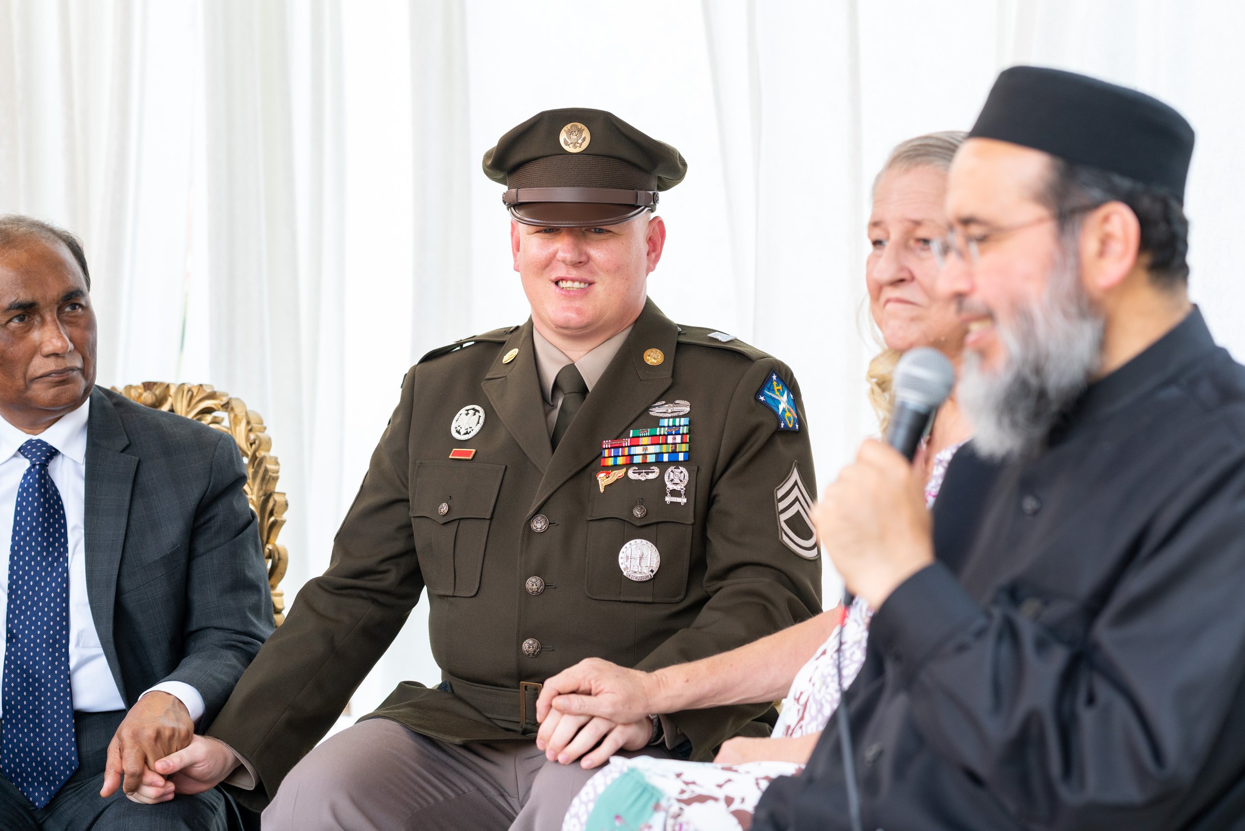 Groom smiles as the imam shares words of wisdom during muslim wedding