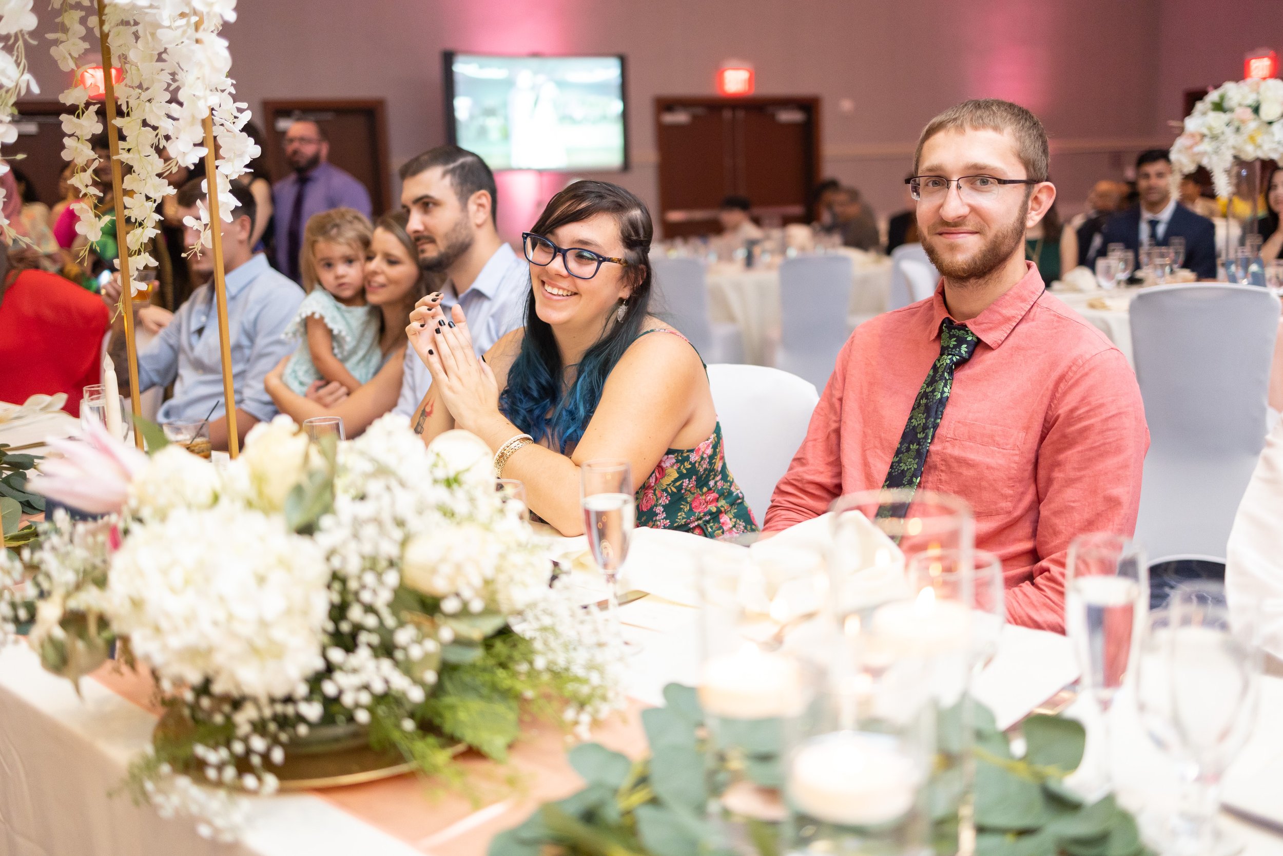 Guests smile at couple dancing at Hyatt Regency Dulles fun wedding