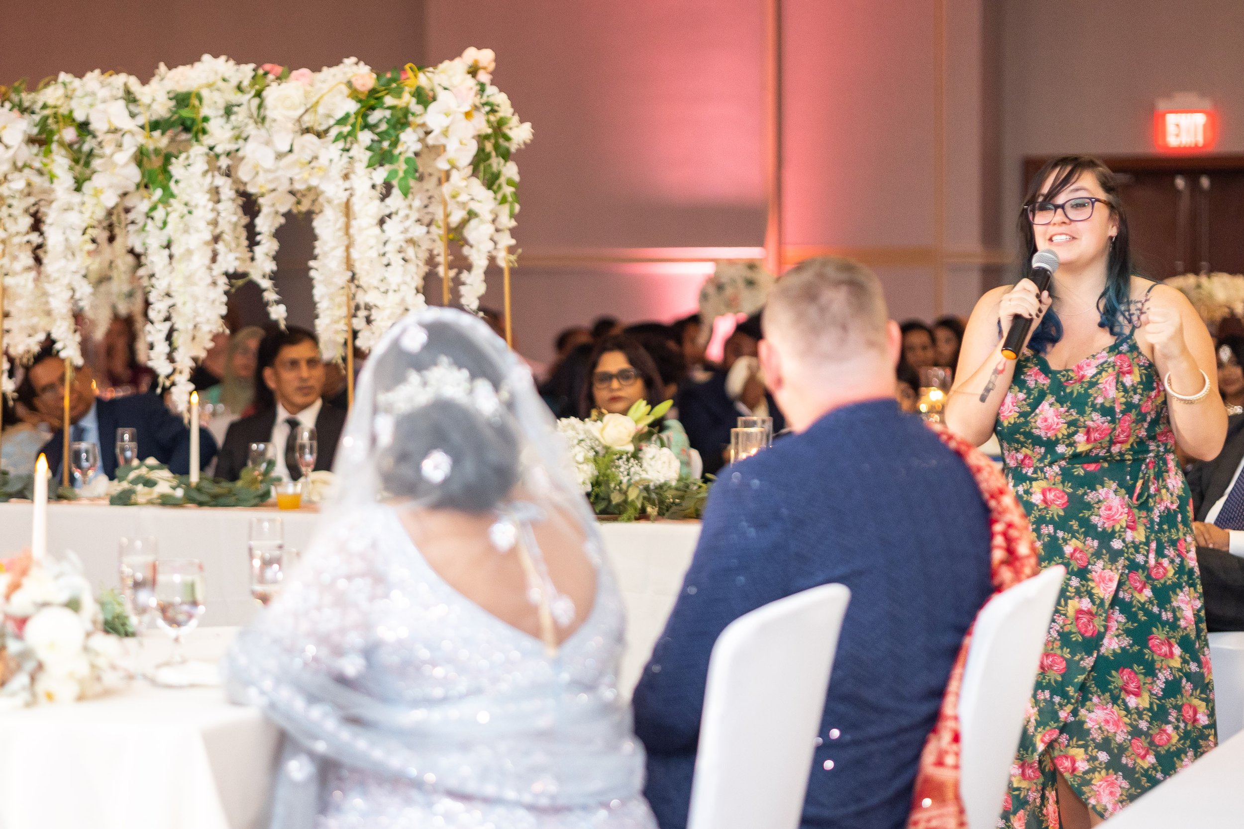 groom's sister gives speech during fun wedding reception