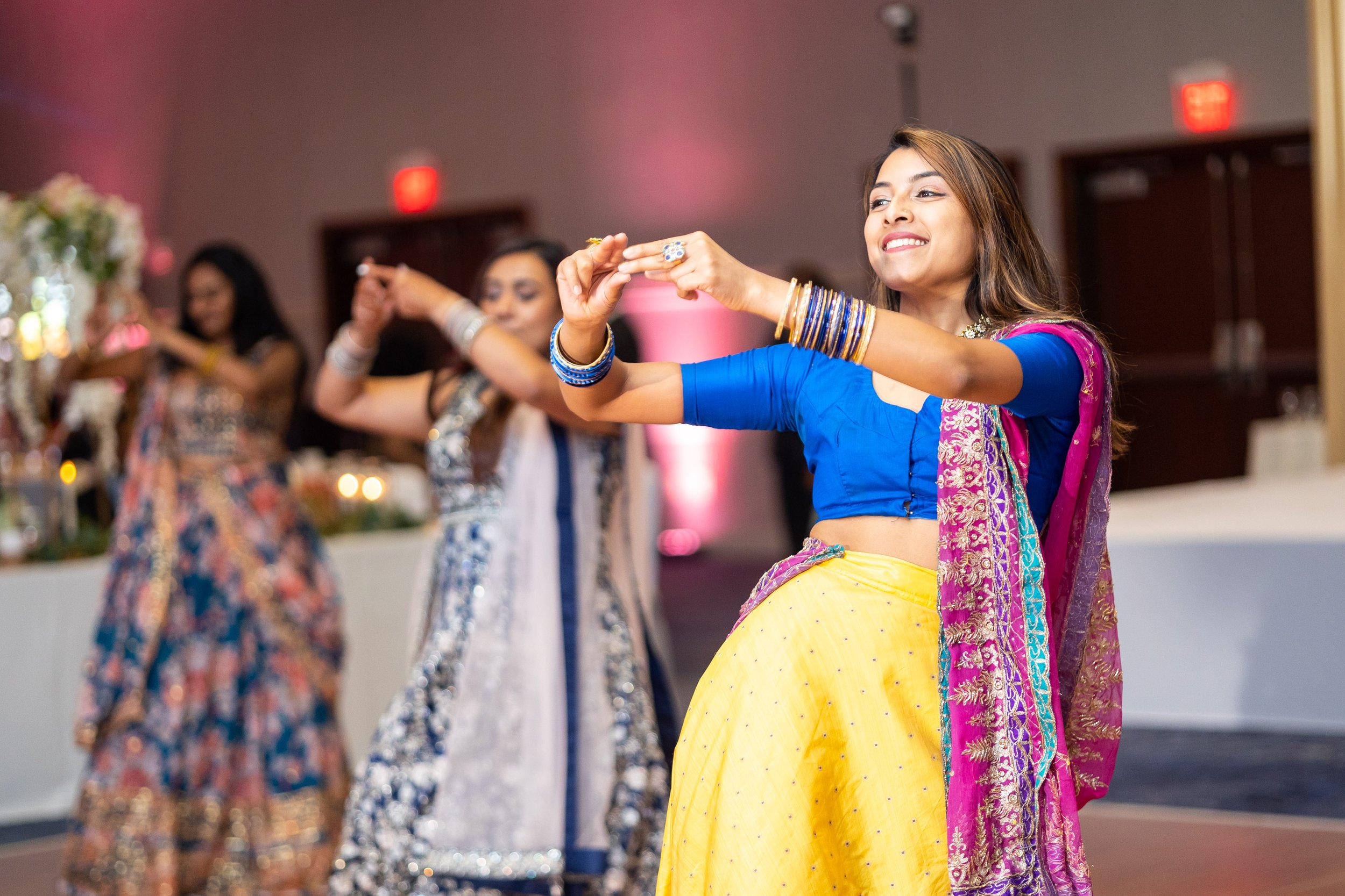 colorful coordinated dance at indian wedding Hyatt regency Dulles