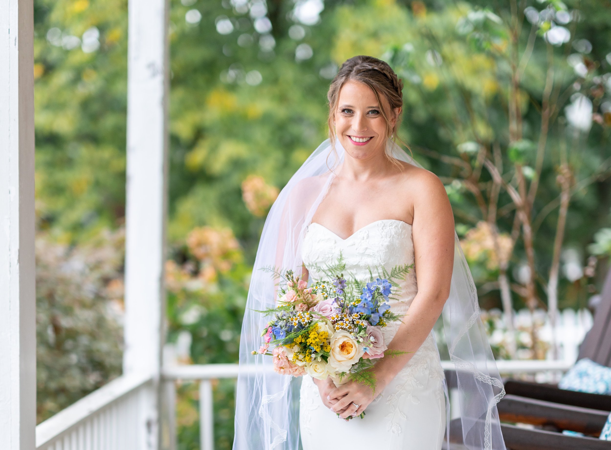 Bride posing on rainy fall day at Stover Hall wedding in Virginia