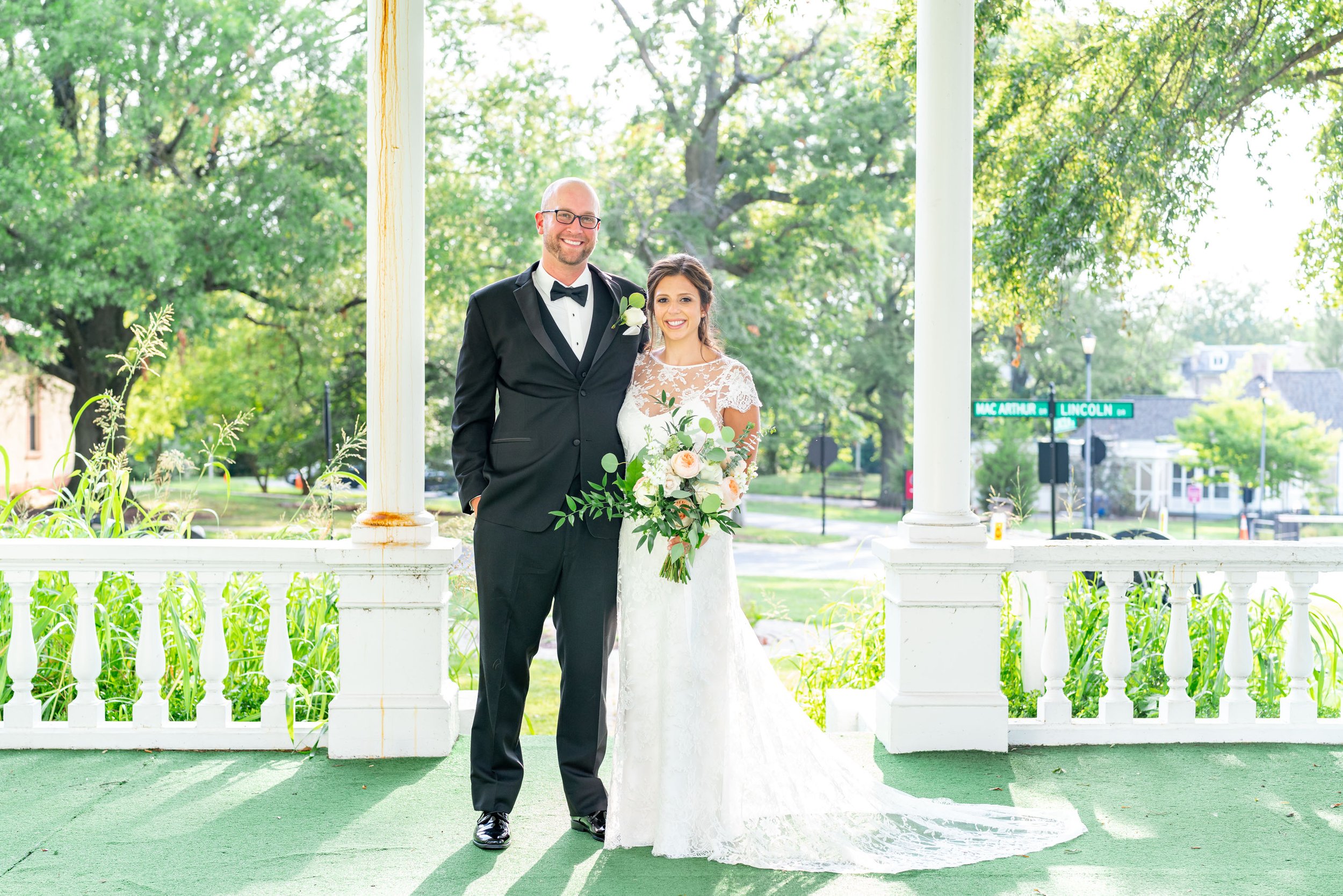 Bride and groom portrait in front of gazebo at President Lincolns Cottage