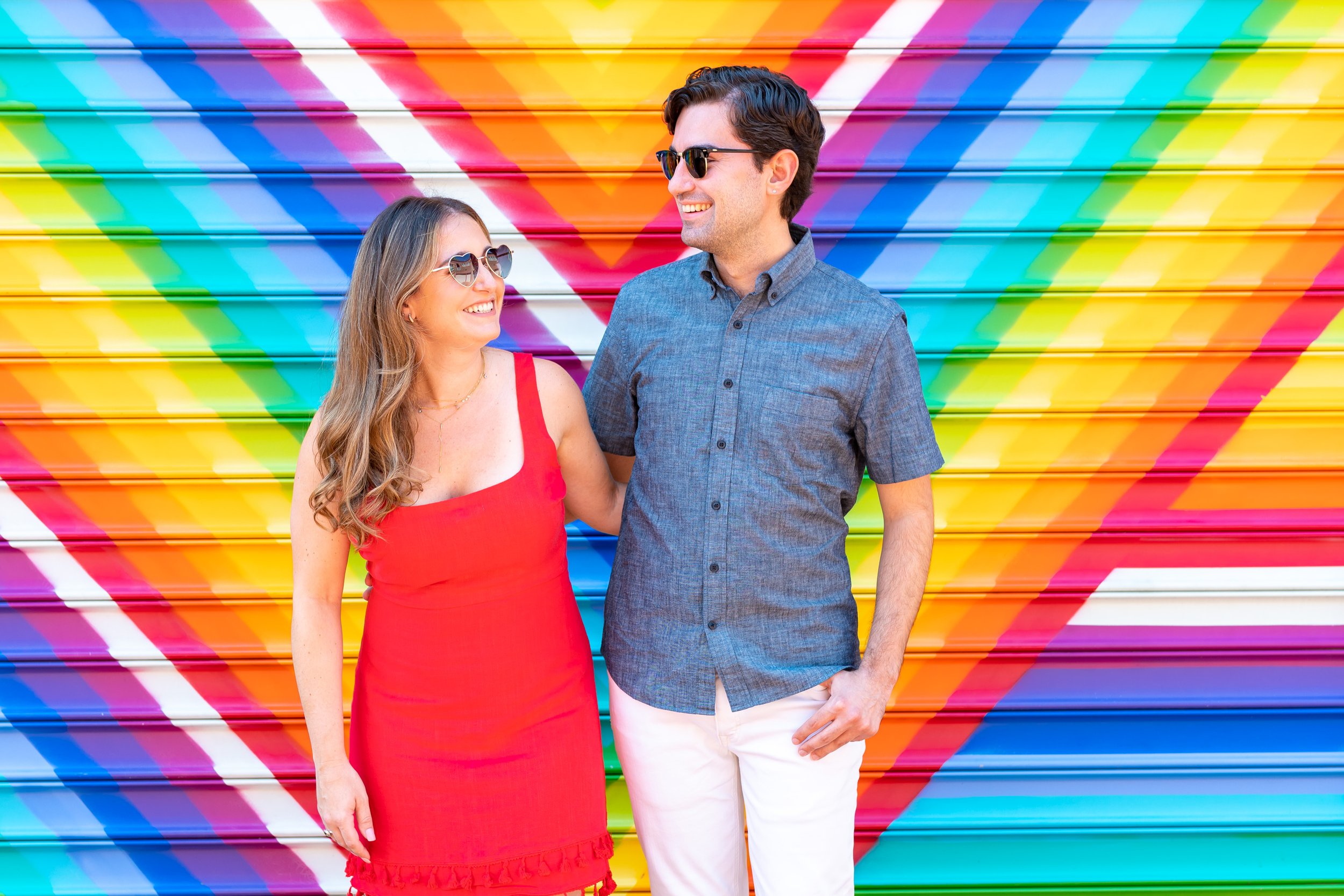 Bride and groom in blagden alley with rainbow wall engagement session