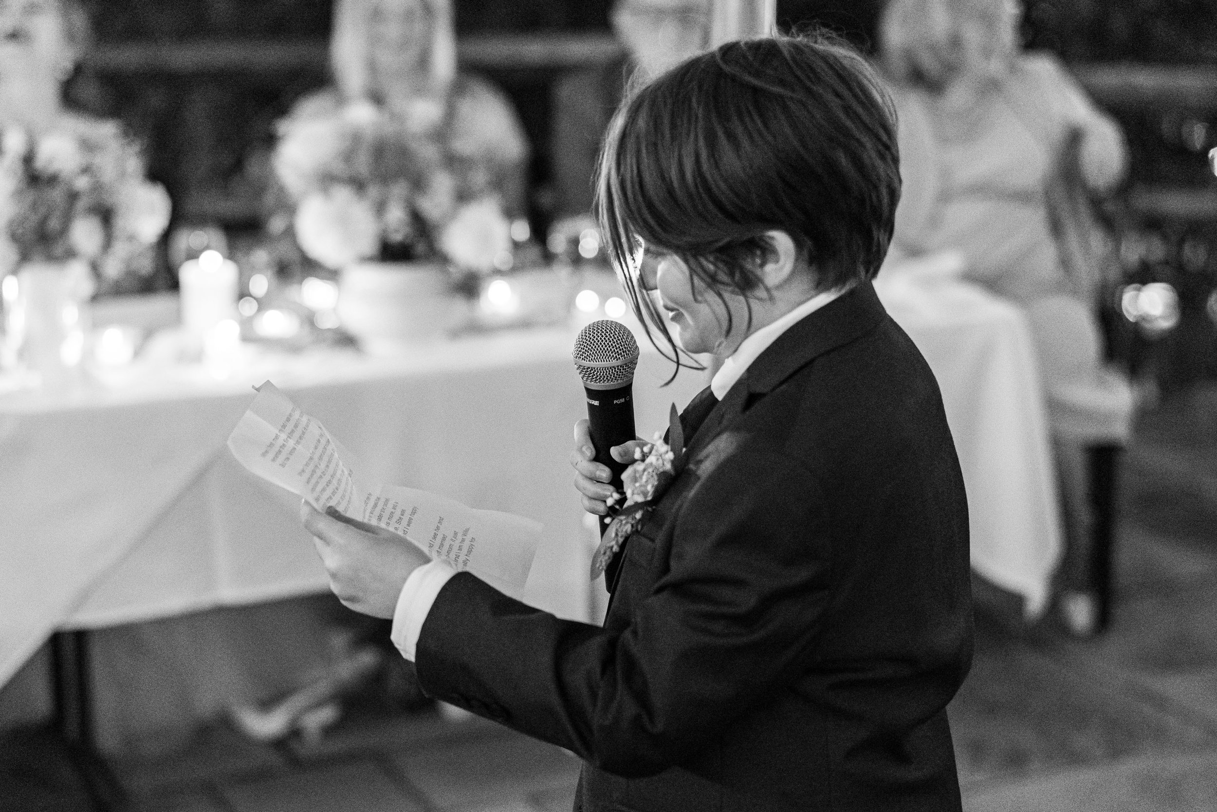 Groom's son reading his speech in black and white