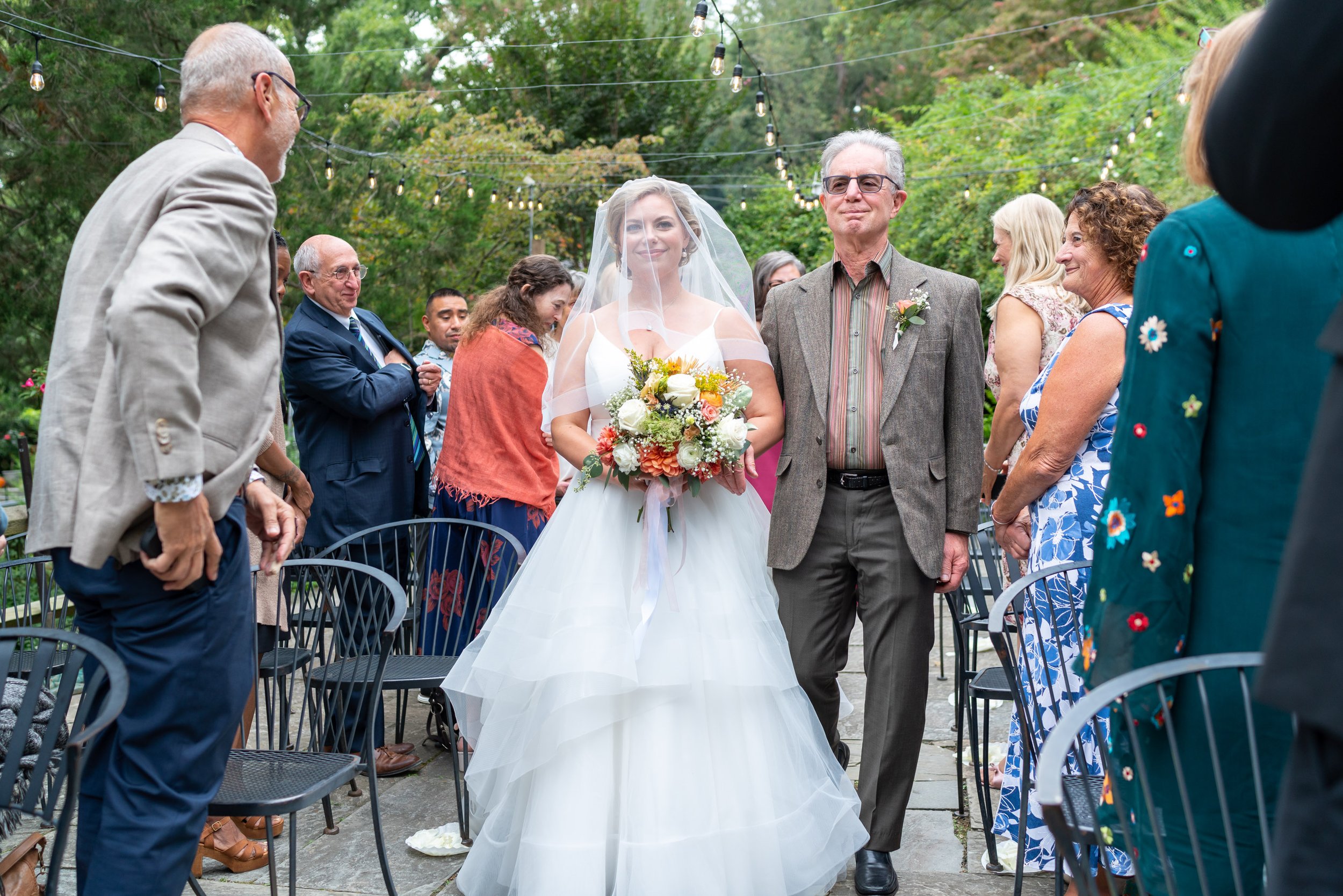 Bride and father walk down the aisle at wedding at Old Angler's Inn