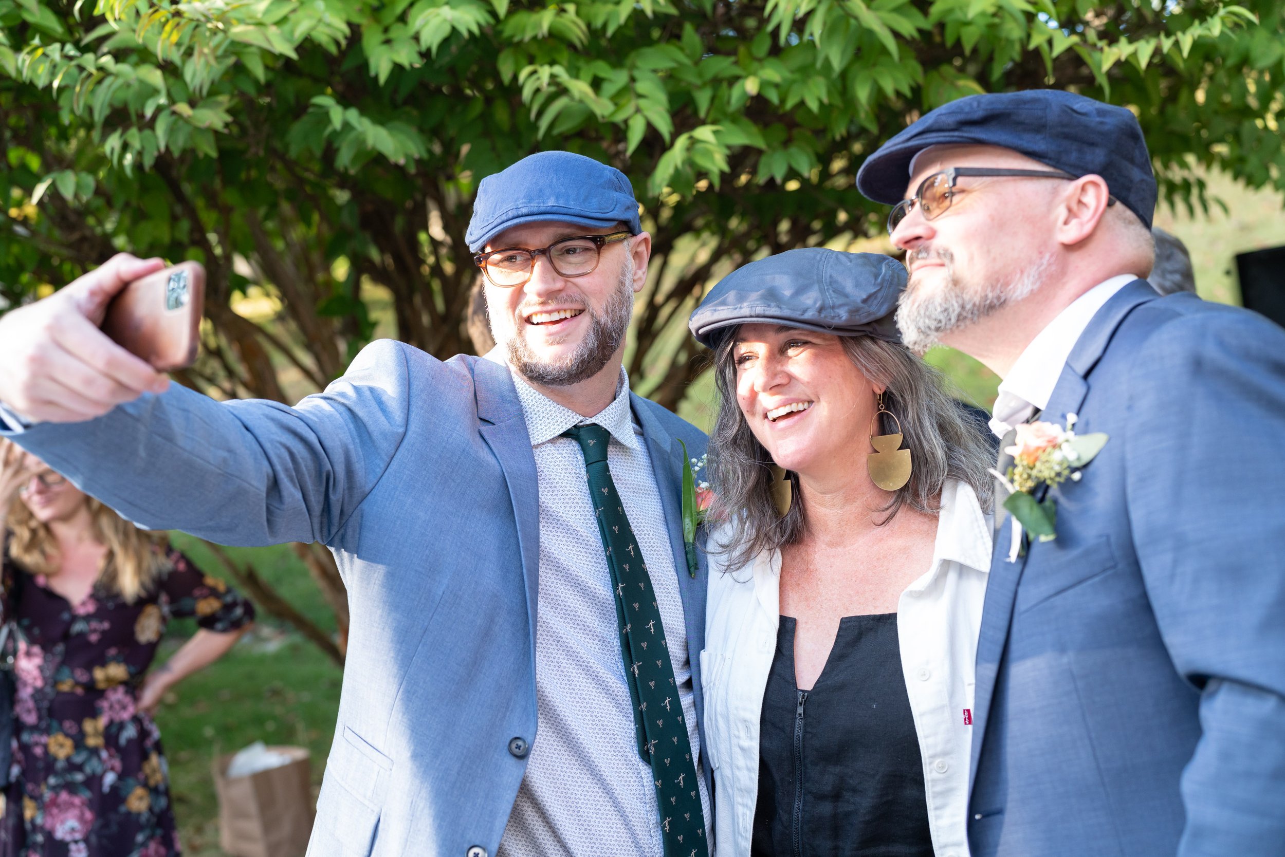 groom and his brother pose for a selfie at Potomac maryland outdoor wedding
