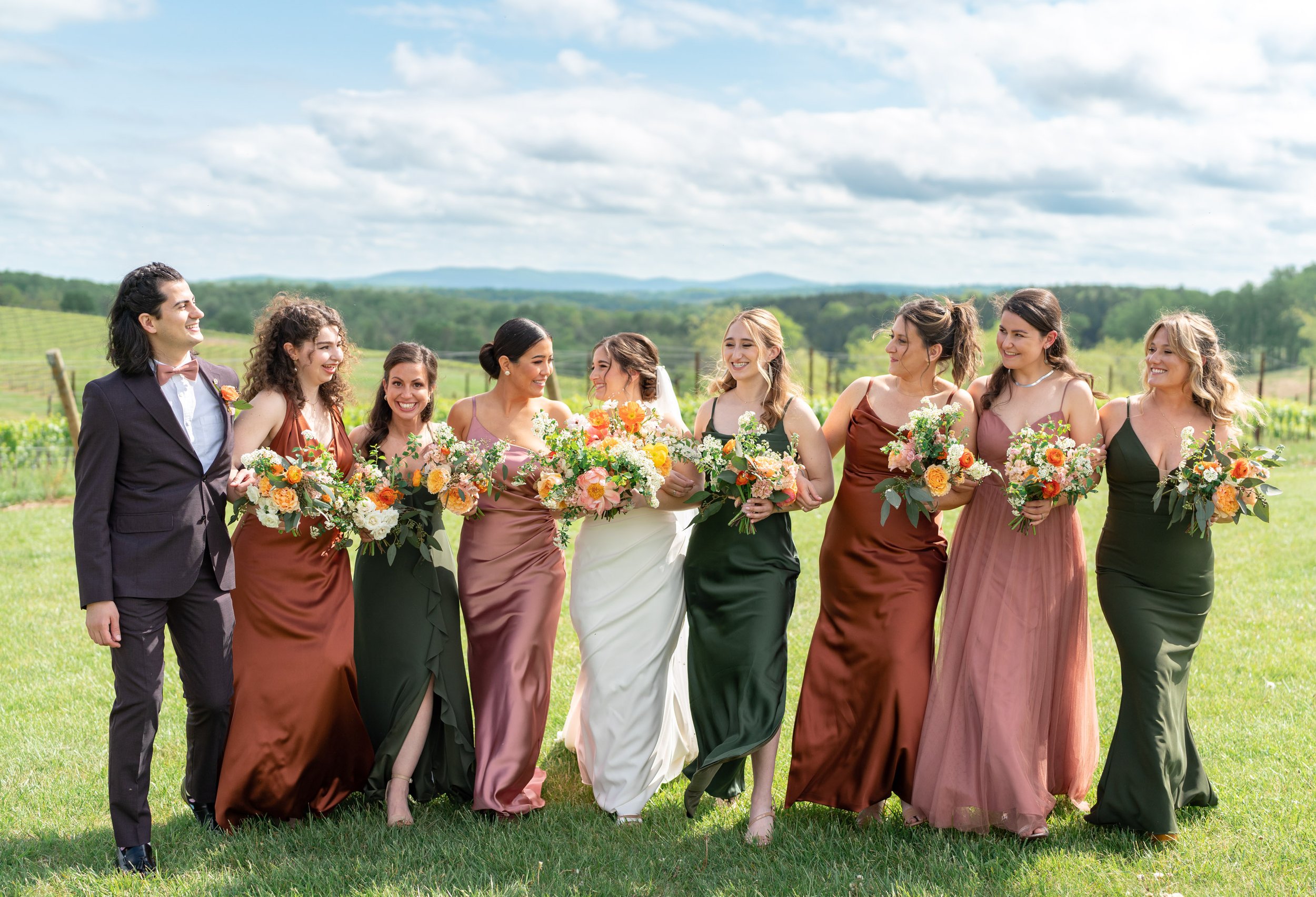 Wedding party at Stone Tower Winery in green, copper and mauve