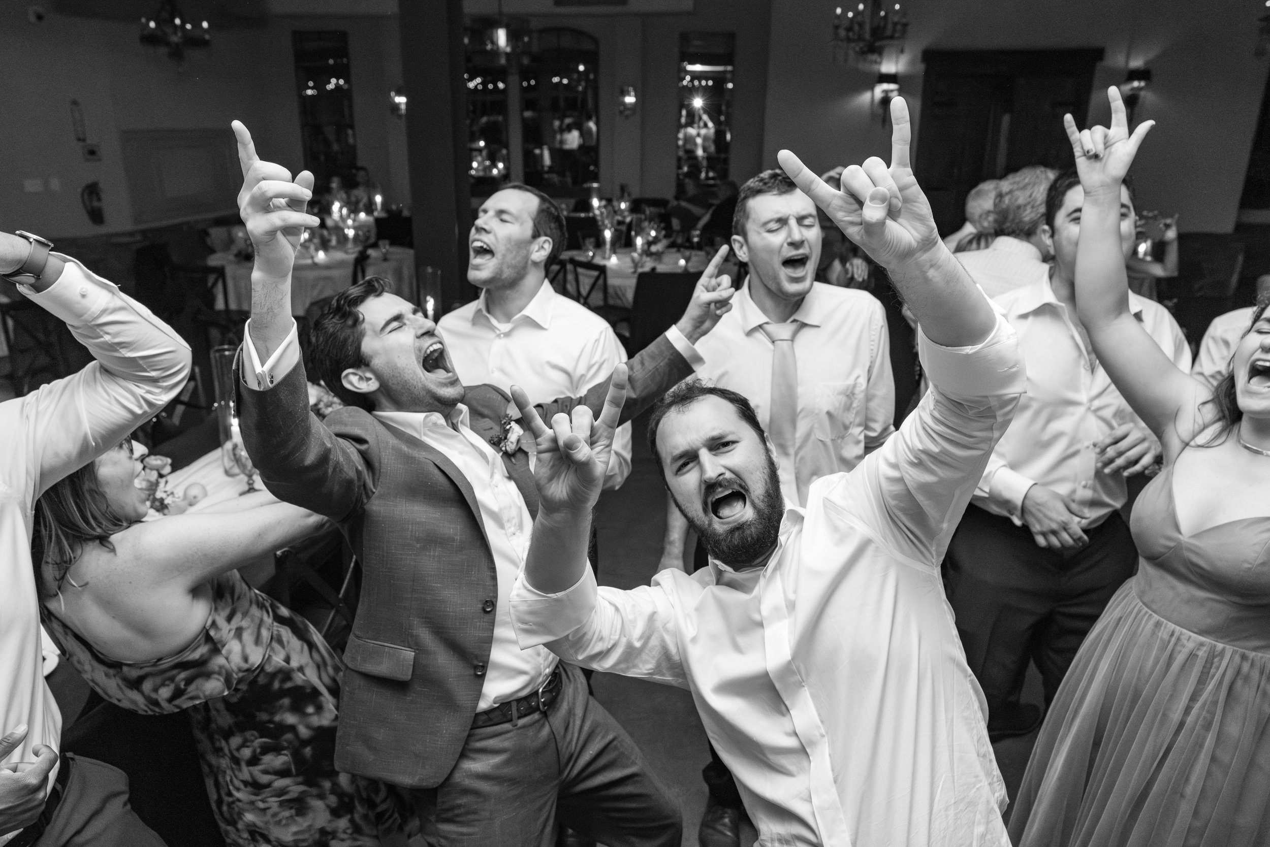 Groom and friends having an epic sing a long on the dance floor with the Bachelor Boys Band