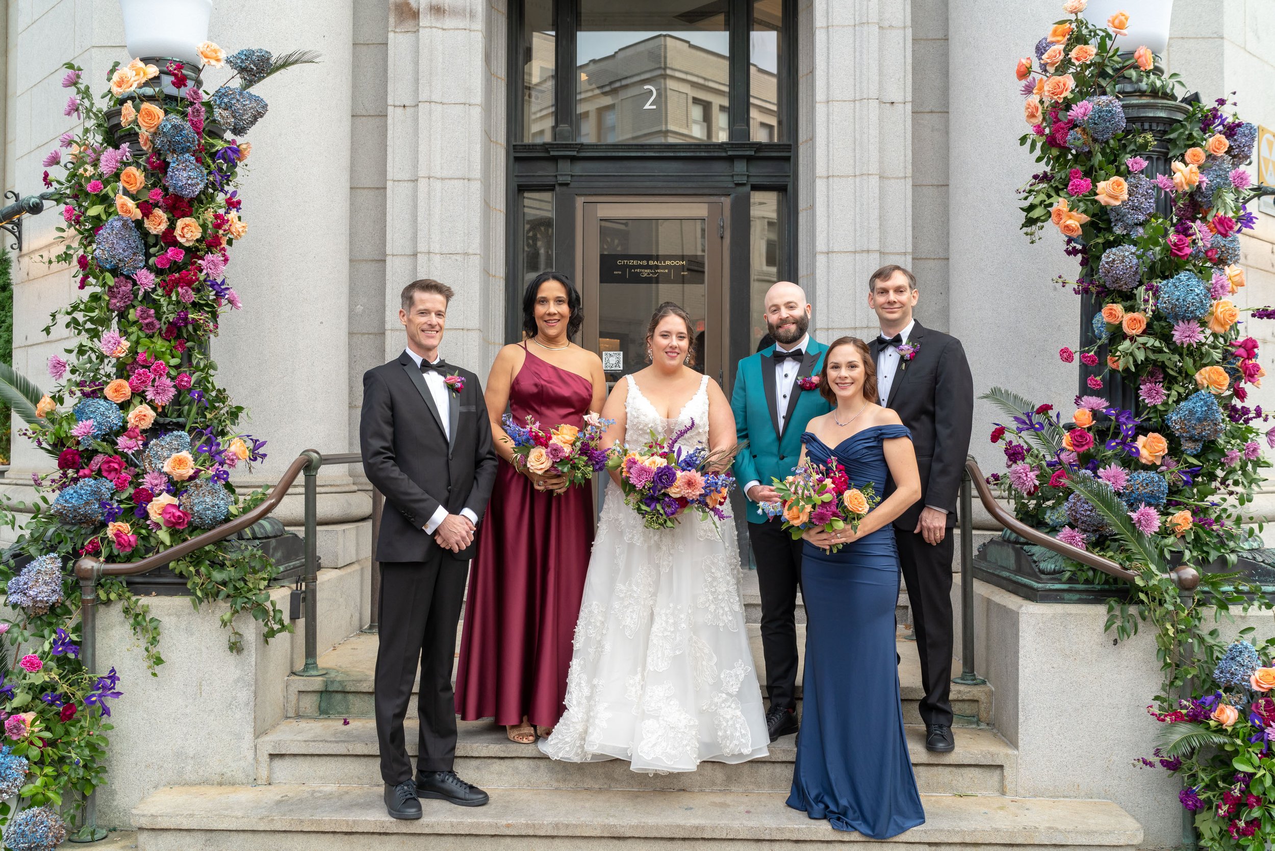 Wedding party on front steps of historic Citizen's Ballroom 